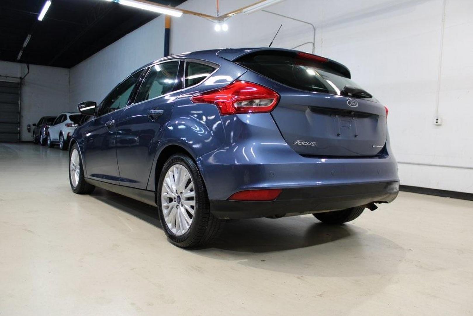 2018 Blue Metallic /Charcoal Black Ford Focus Titanium (1FADP3N28JL) with an 2.0L I4 DGI Ti-VCT engine, Automatic transmission, located at 15300 Midway Rd., Addison, TX, 75001, (972) 702-0011, 32.958321, -96.838074 - Photo#3