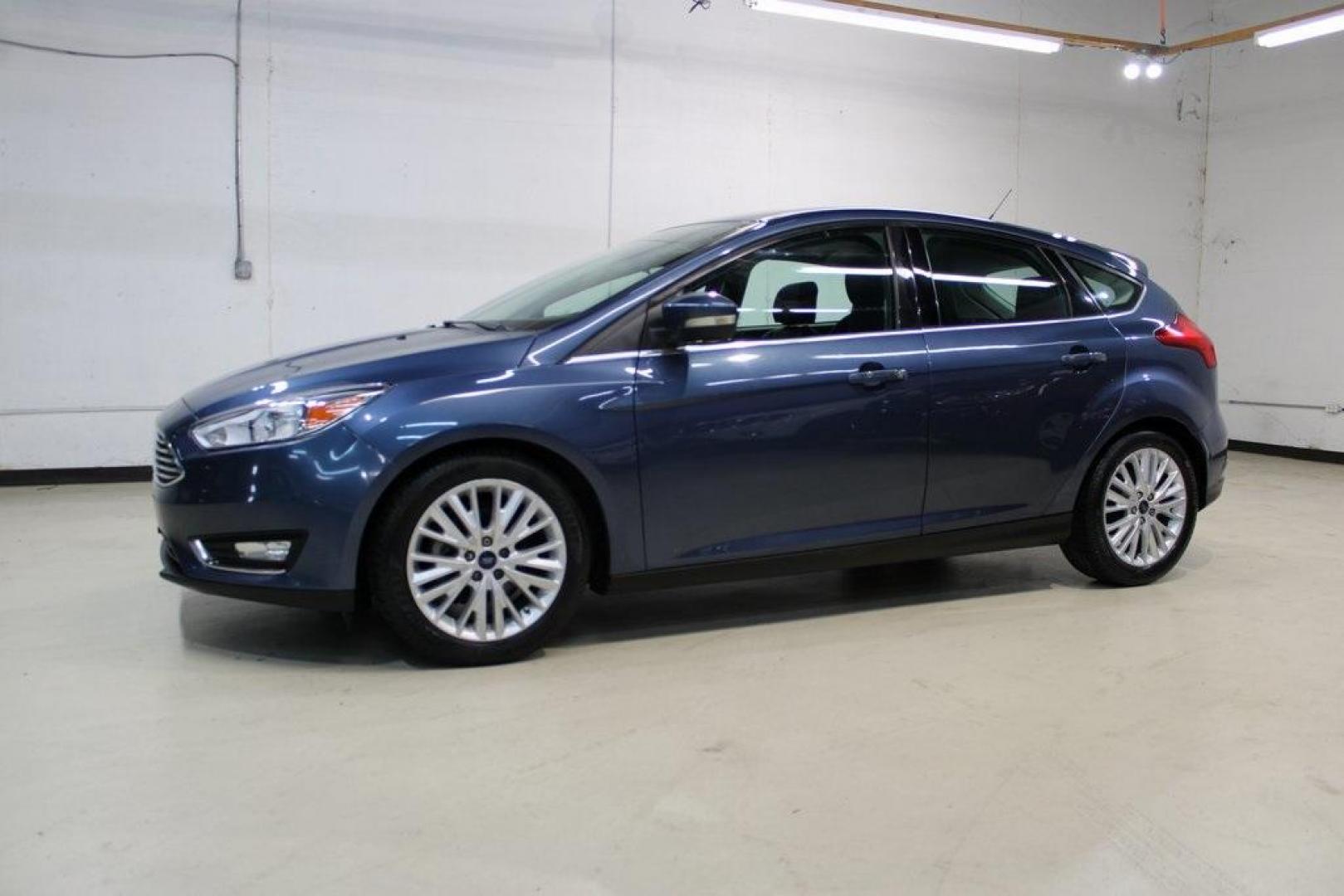 2018 Blue Metallic /Charcoal Black Ford Focus Titanium (1FADP3N28JL) with an 2.0L I4 DGI Ti-VCT engine, Automatic transmission, located at 15300 Midway Rd., Addison, TX, 75001, (972) 702-0011, 32.958321, -96.838074 - Photo#4