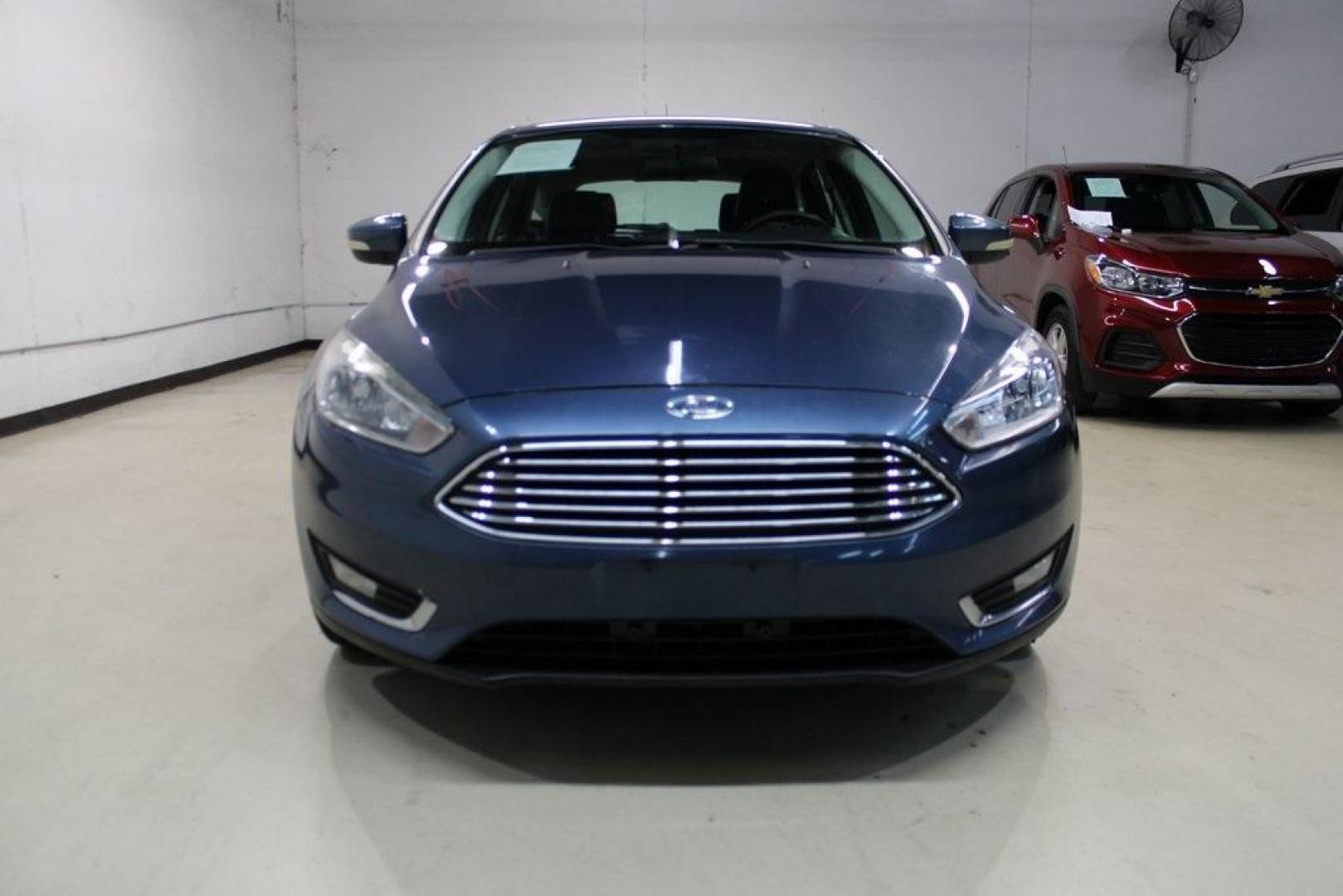 2018 Blue Metallic /Charcoal Black Ford Focus Titanium (1FADP3N28JL) with an 2.0L I4 DGI Ti-VCT engine, Automatic transmission, located at 15300 Midway Rd., Addison, TX, 75001, (972) 702-0011, 32.958321, -96.838074 - Photo#5