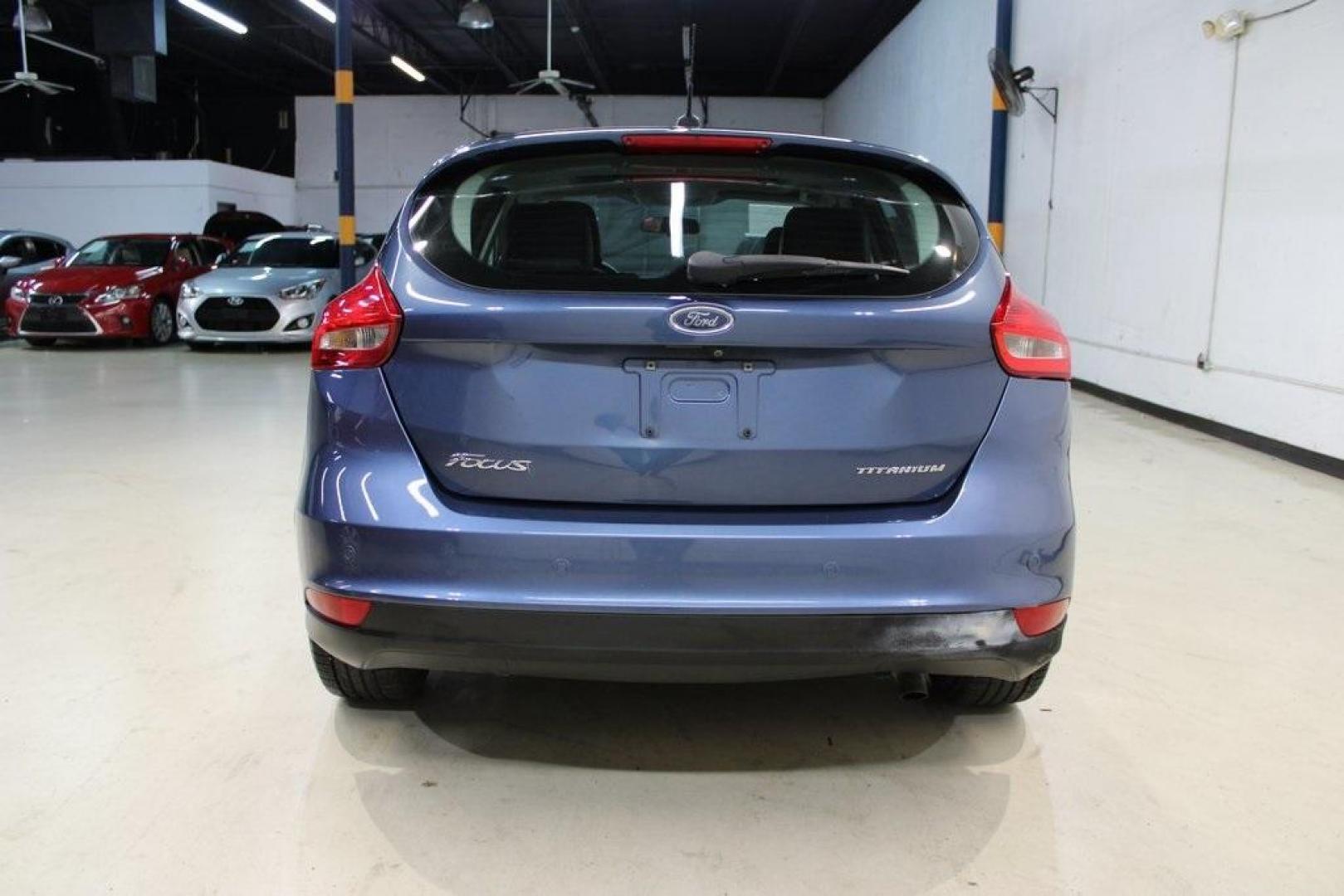 2018 Blue Metallic /Charcoal Black Ford Focus Titanium (1FADP3N28JL) with an 2.0L I4 DGI Ti-VCT engine, Automatic transmission, located at 15300 Midway Rd., Addison, TX, 75001, (972) 702-0011, 32.958321, -96.838074 - Photo#7