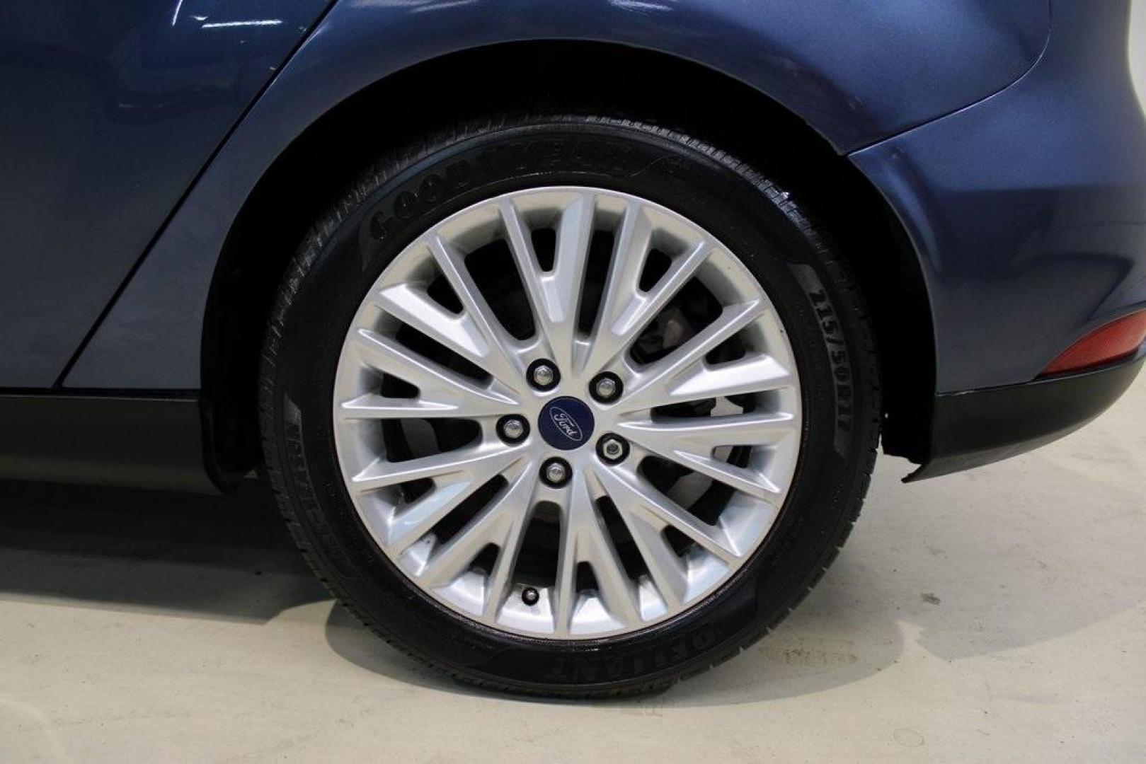 2018 Blue Metallic /Charcoal Black Ford Focus Titanium (1FADP3N28JL) with an 2.0L I4 DGI Ti-VCT engine, Automatic transmission, located at 15300 Midway Rd., Addison, TX, 75001, (972) 702-0011, 32.958321, -96.838074 - Photo#9
