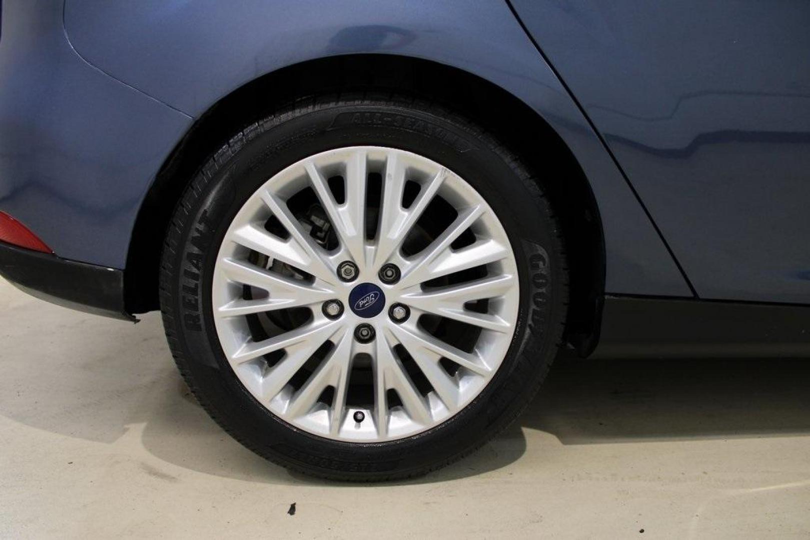 2018 Blue Metallic /Charcoal Black Ford Focus Titanium (1FADP3N28JL) with an 2.0L I4 DGI Ti-VCT engine, Automatic transmission, located at 15300 Midway Rd., Addison, TX, 75001, (972) 702-0011, 32.958321, -96.838074 - Photo#10