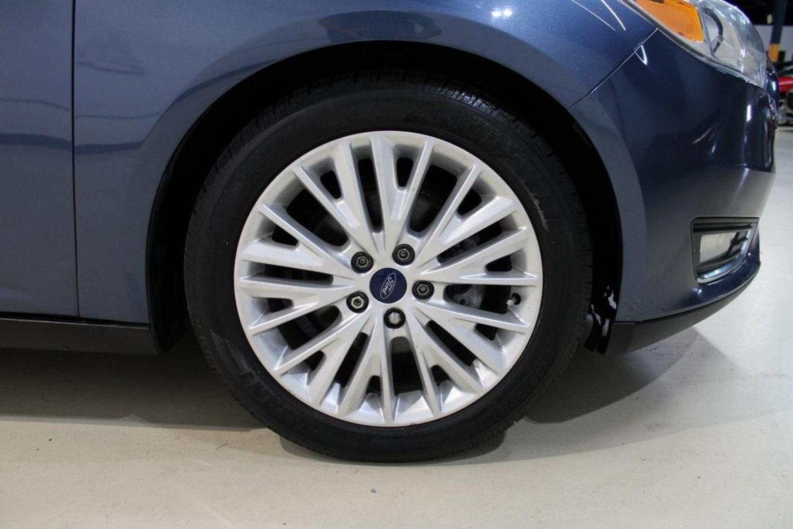 2018 Blue Metallic /Charcoal Black Ford Focus Titanium (1FADP3N28JL) with an 2.0L I4 DGI Ti-VCT engine, Automatic transmission, located at 15300 Midway Rd., Addison, TX, 75001, (972) 702-0011, 32.958321, -96.838074 - Photo#11