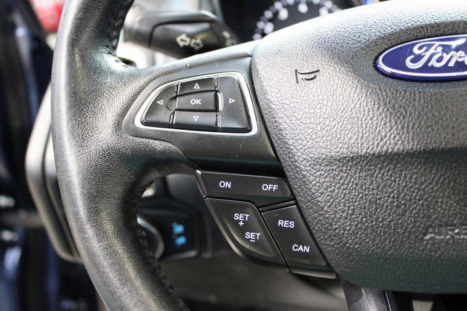 2018 Blue Metallic /Charcoal Black Ford Focus Titanium (1FADP3N28JL) with an 2.0L I4 DGI Ti-VCT engine, Automatic transmission, located at 15300 Midway Rd., Addison, TX, 75001, (972) 702-0011, 32.958321, -96.838074 - Photo#23