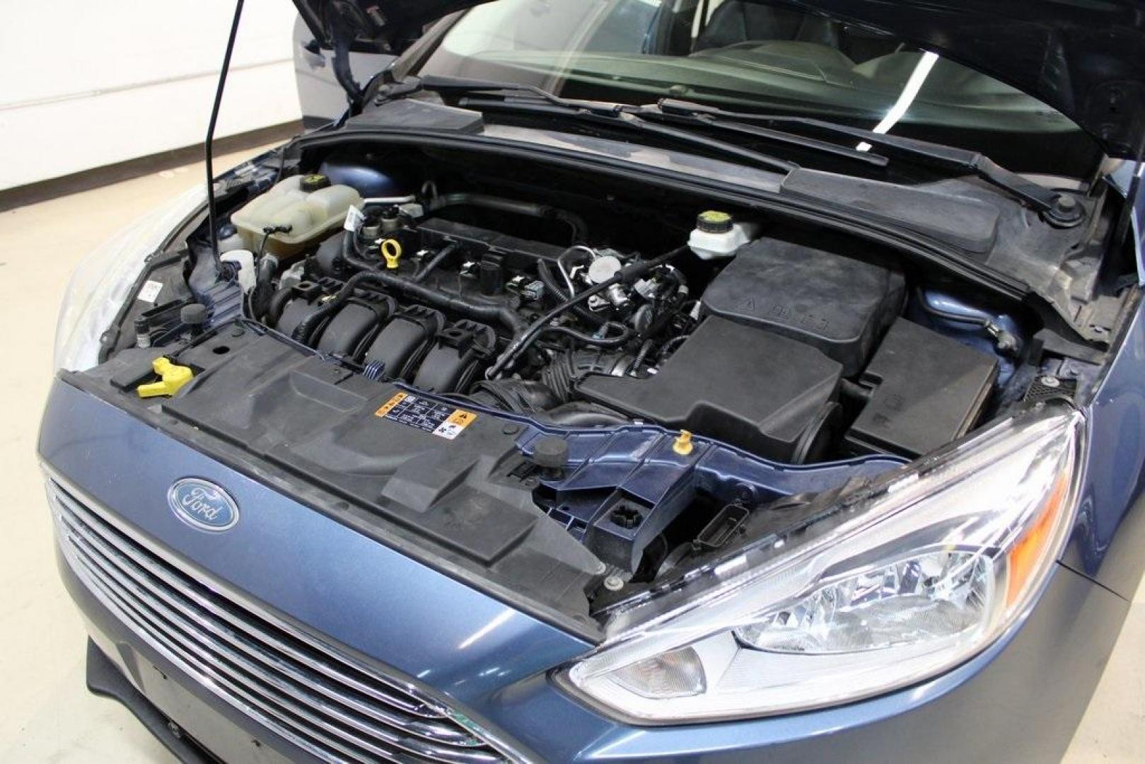 2018 Blue Metallic /Charcoal Black Ford Focus Titanium (1FADP3N28JL) with an 2.0L I4 DGI Ti-VCT engine, Automatic transmission, located at 15300 Midway Rd., Addison, TX, 75001, (972) 702-0011, 32.958321, -96.838074 - Photo#28