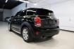 2019 Midnight Black Metallic /Carbon Black MINI Cooper Countryman Iconic (WMZYS7C55K3) with an 1.5L I-3 engine, Automatic transmission, located at 15300 Midway Rd., Addison, TX, 75001, (972) 702-0011, 32.958321, -96.838074 - 2019 MINI Countryman Cooper S ALL4<br>Now Available at Midway Auto Group Addison, Texas<br><br>Blending iconic MINI styling with SUV versatility, the 2019 MINI Countryman Cooper S ALL4 offers a fun-to-drive experience with added space, premium features, and all-wheel drive capability. Whether you'r - Photo#2