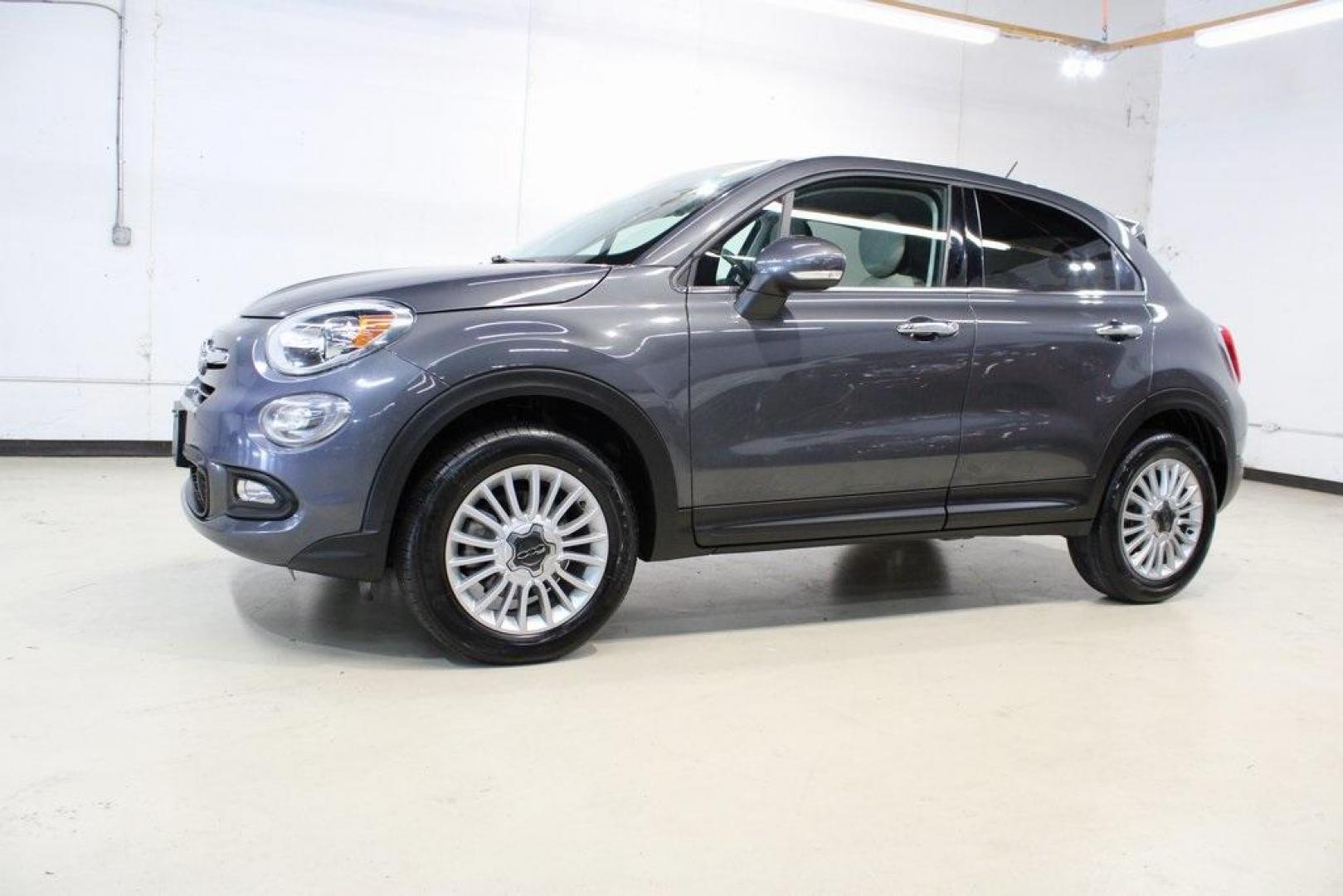 2017 Grigio Graphite (Graphite Gray) /Lt Pebble Beige/Dk Slate Fiat 500X Lounge (ZFBCFYDB3HP) with an 2.4L I4 MultiAir engine, Automatic transmission, located at 15300 Midway Rd., Addison, TX, 75001, (972) 702-0011, 32.958321, -96.838074 - 2017 FIAT 500L Trekking<br>Now Available at Midway Auto Group Addison, Texas<br><br>Stand out from the crowd with the bold styling, roomy interior, and European flair of the 2017 FIAT 500L Trekking. This uniquely designed crossover blends urban-friendly dimensions with SUV-like practicality, offeri - Photo#4