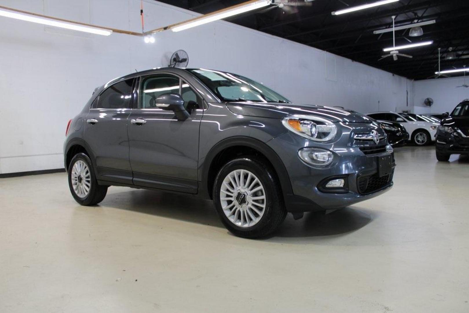 2017 Grigio Graphite (Graphite Gray) /Lt Pebble Beige/Dk Slate Fiat 500X Lounge (ZFBCFYDB3HP) with an 2.4L I4 MultiAir engine, Automatic transmission, located at 15300 Midway Rd., Addison, TX, 75001, (972) 702-0011, 32.958321, -96.838074 - 2017 FIAT 500L Trekking<br>Now Available at Midway Auto Group Addison, Texas<br><br>Stand out from the crowd with the bold styling, roomy interior, and European flair of the 2017 FIAT 500L Trekking. This uniquely designed crossover blends urban-friendly dimensions with SUV-like practicality, offeri - Photo#6