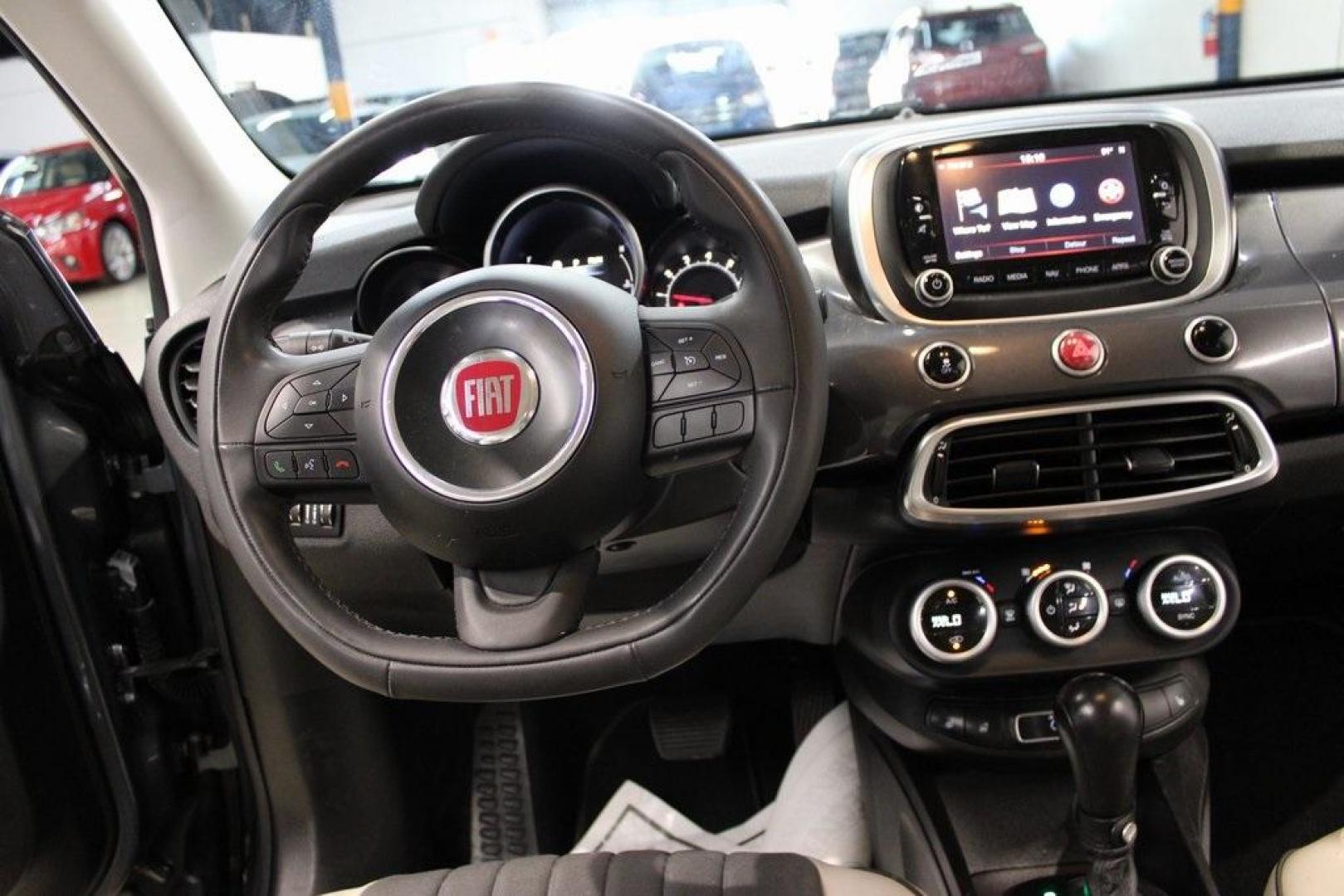 2017 Grigio Graphite (Graphite Gray) /Lt Pebble Beige/Dk Slate Fiat 500X Lounge (ZFBCFYDB3HP) with an 2.4L I4 MultiAir engine, Automatic transmission, located at 15300 Midway Rd., Addison, TX, 75001, (972) 702-0011, 32.958321, -96.838074 - 2017 FIAT 500L Trekking<br>Now Available at Midway Auto Group Addison, Texas<br><br>Stand out from the crowd with the bold styling, roomy interior, and European flair of the 2017 FIAT 500L Trekking. This uniquely designed crossover blends urban-friendly dimensions with SUV-like practicality, offeri - Photo#16