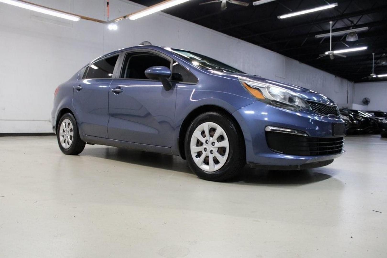 2016 Urban Blue Pearl Metallic /Black Kia Rio LX (KNADM4A30G6) with an 1.6L I4 DGI 16V engine, Automatic transmission, located at 15300 Midway Rd., Addison, TX, 75001, (972) 702-0011, 32.958321, -96.838074 - 2016 Kia Rio LX<br>Now Available at Midway Auto Group Addison, Texas<br><br>Efficient, reliable, and easy to drivethe 2016 Kia Rio LX is a smart choice for anyone seeking affordable transportation without sacrificing comfort or style. With its compact size, strong fuel economy, and solid build qual - Photo#1