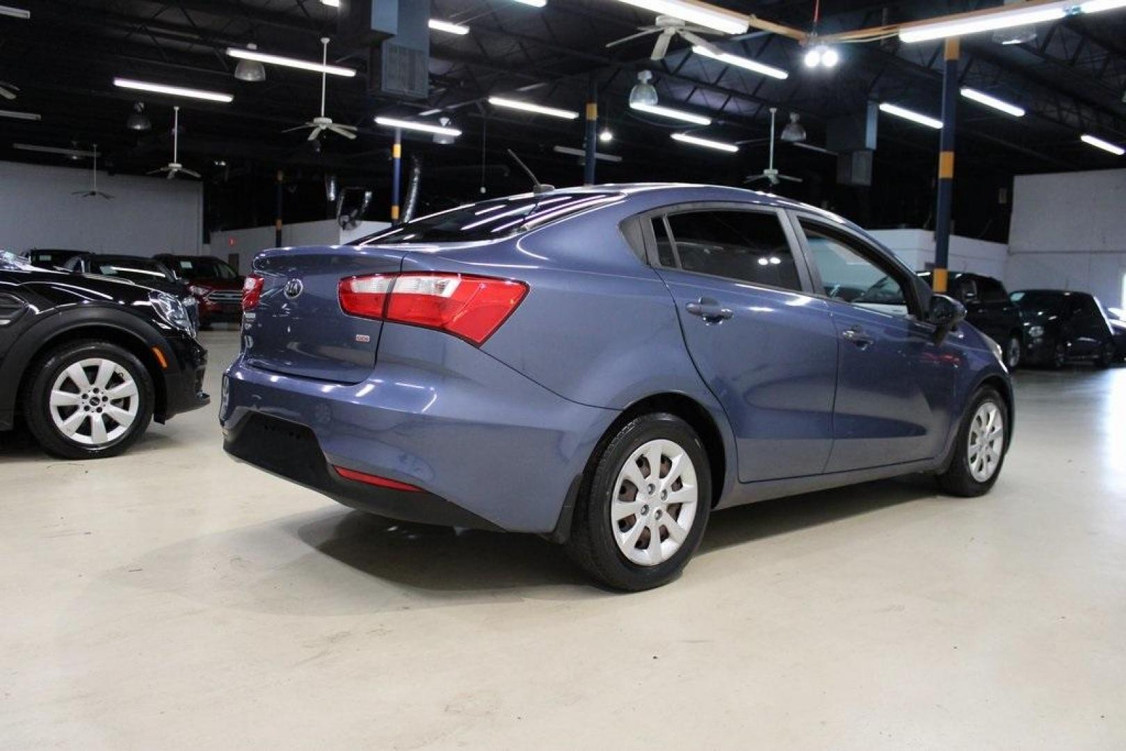 2016 Urban Blue Pearl Metallic /Black Kia Rio LX (KNADM4A30G6) with an 1.6L I4 DGI 16V engine, Automatic transmission, located at 15300 Midway Rd., Addison, TX, 75001, (972) 702-0011, 32.958321, -96.838074 - 2016 Kia Rio LX<br>Now Available at Midway Auto Group Addison, Texas<br><br>Efficient, reliable, and easy to drivethe 2016 Kia Rio LX is a smart choice for anyone seeking affordable transportation without sacrificing comfort or style. With its compact size, strong fuel economy, and solid build qual - Photo#2