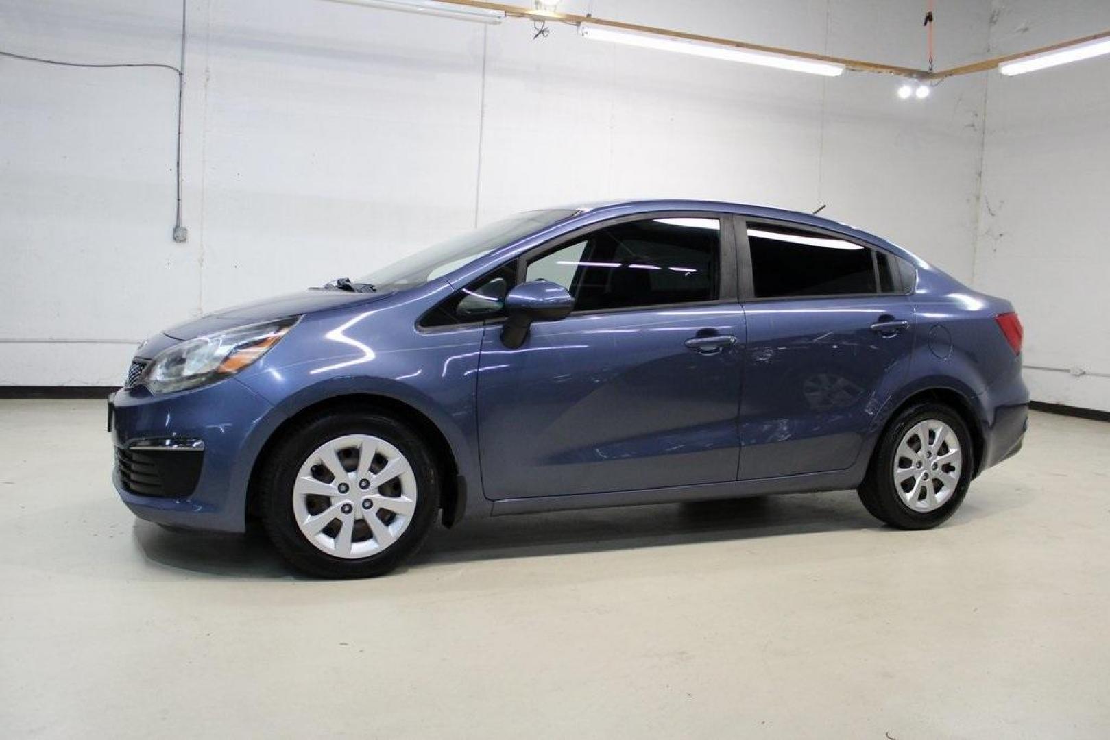 2016 Urban Blue Pearl Metallic /Black Kia Rio LX (KNADM4A30G6) with an 1.6L I4 DGI 16V engine, Automatic transmission, located at 15300 Midway Rd., Addison, TX, 75001, (972) 702-0011, 32.958321, -96.838074 - 2016 Kia Rio LX<br>Now Available at Midway Auto Group Addison, Texas<br><br>Efficient, reliable, and easy to drivethe 2016 Kia Rio LX is a smart choice for anyone seeking affordable transportation without sacrificing comfort or style. With its compact size, strong fuel economy, and solid build qual - Photo#4