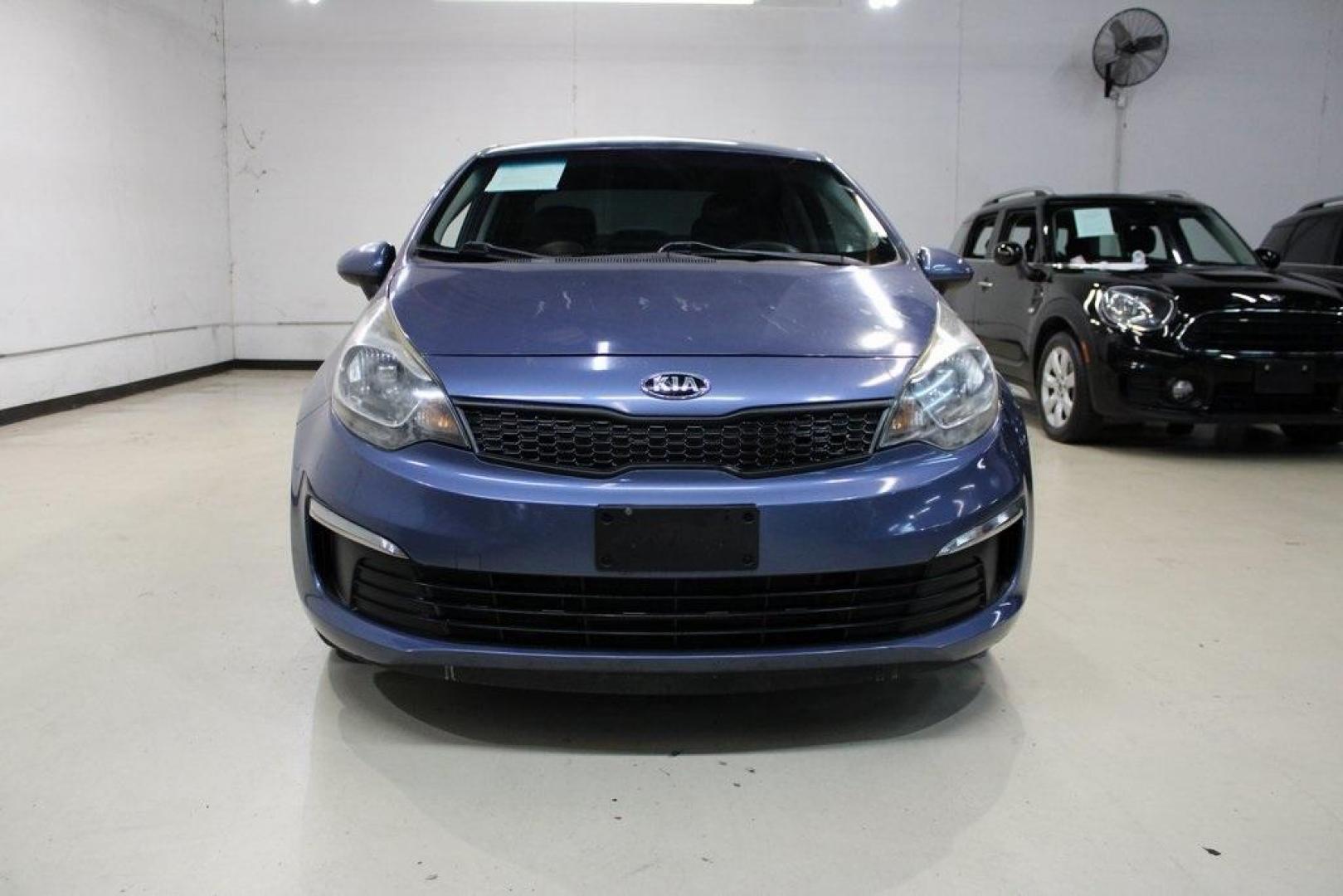 2016 Urban Blue Pearl Metallic /Black Kia Rio LX (KNADM4A30G6) with an 1.6L I4 DGI 16V engine, Automatic transmission, located at 15300 Midway Rd., Addison, TX, 75001, (972) 702-0011, 32.958321, -96.838074 - 2016 Kia Rio LX<br>Now Available at Midway Auto Group Addison, Texas<br><br>Efficient, reliable, and easy to drivethe 2016 Kia Rio LX is a smart choice for anyone seeking affordable transportation without sacrificing comfort or style. With its compact size, strong fuel economy, and solid build qual - Photo#5