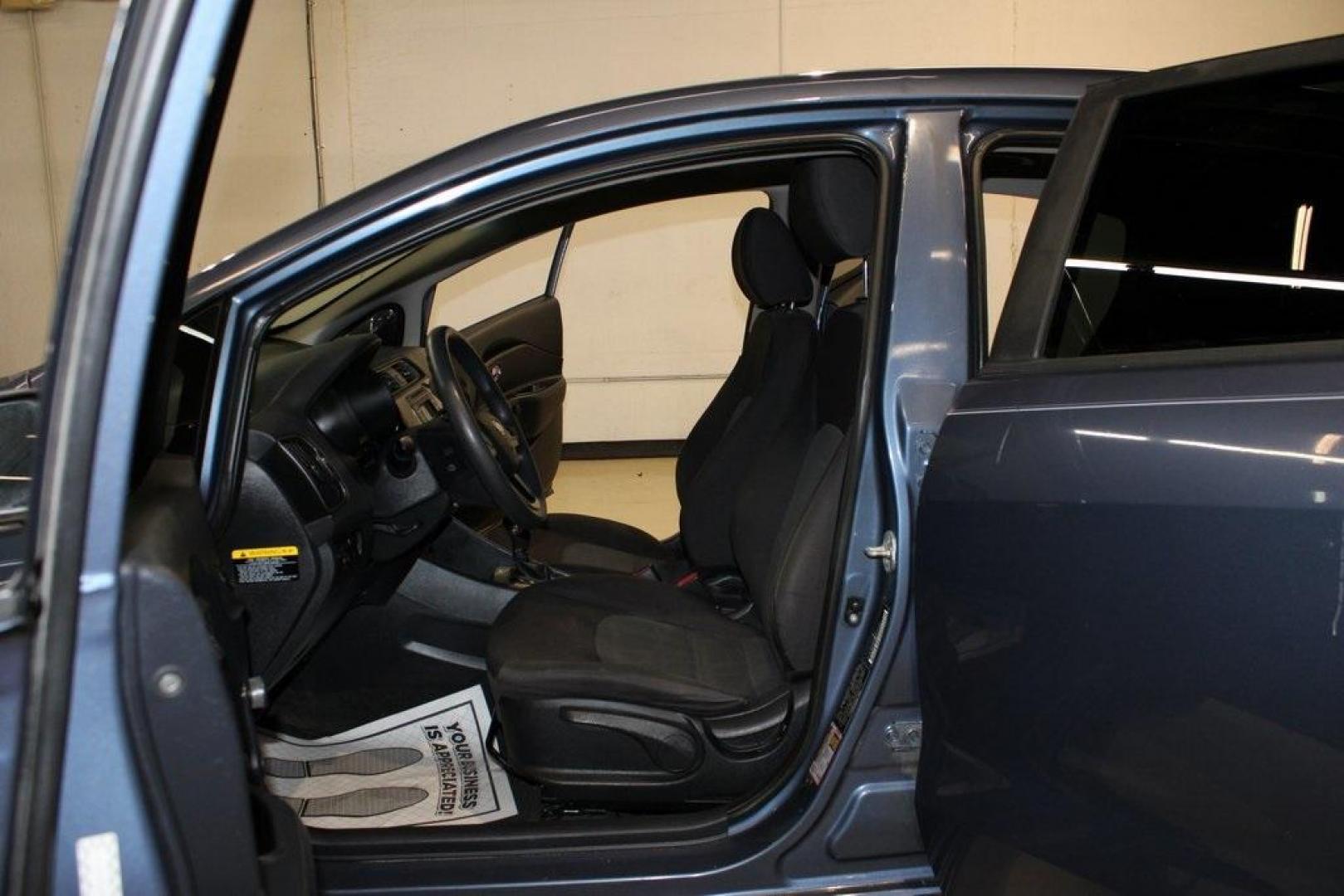 2016 Urban Blue Pearl Metallic /Black Kia Rio LX (KNADM4A30G6) with an 1.6L I4 DGI 16V engine, Automatic transmission, located at 15300 Midway Rd., Addison, TX, 75001, (972) 702-0011, 32.958321, -96.838074 - 2016 Kia Rio LX<br>Now Available at Midway Auto Group Addison, Texas<br><br>Efficient, reliable, and easy to drivethe 2016 Kia Rio LX is a smart choice for anyone seeking affordable transportation without sacrificing comfort or style. With its compact size, strong fuel economy, and solid build qual - Photo#11