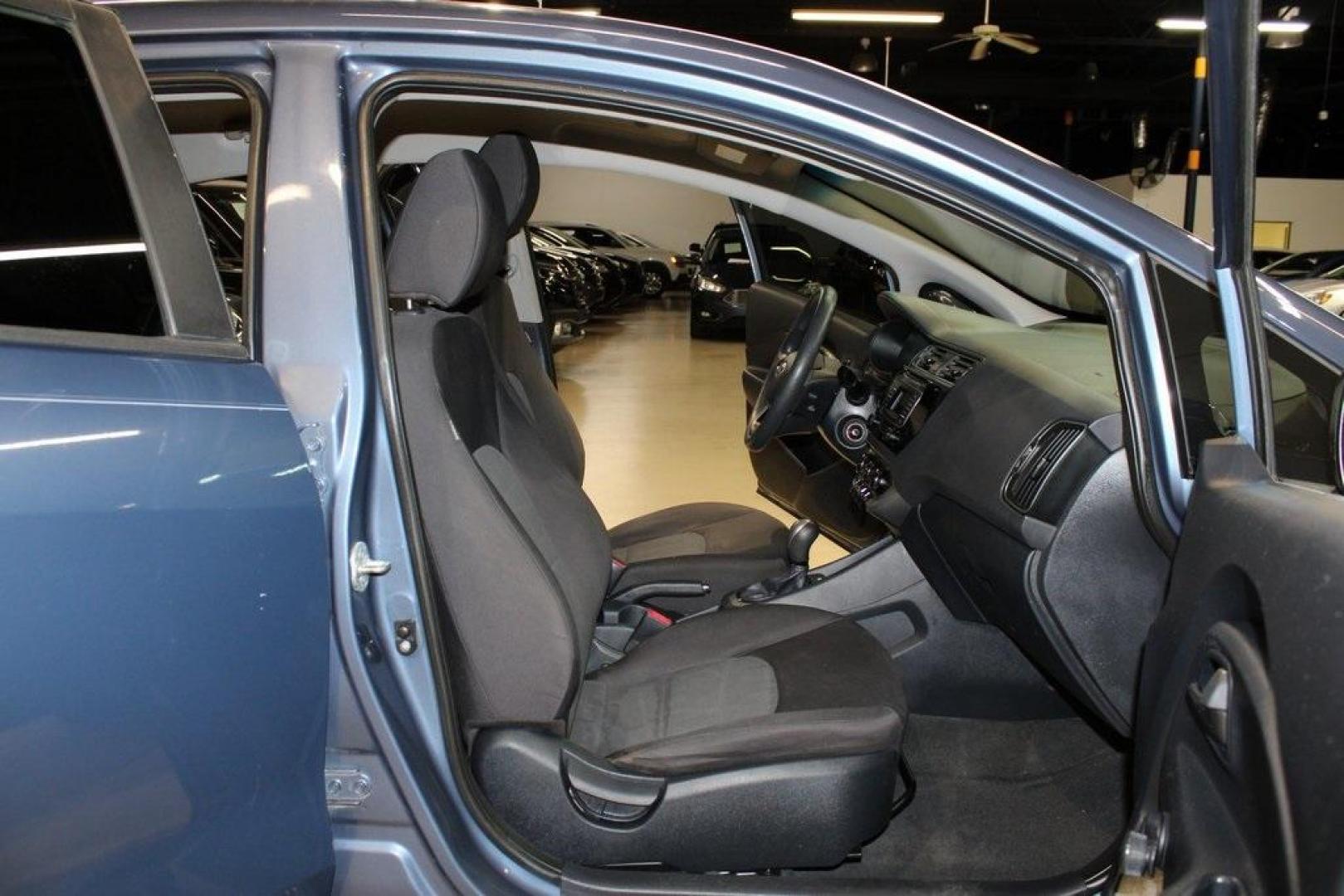 2016 Urban Blue Pearl Metallic /Black Kia Rio LX (KNADM4A30G6) with an 1.6L I4 DGI 16V engine, Automatic transmission, located at 15300 Midway Rd., Addison, TX, 75001, (972) 702-0011, 32.958321, -96.838074 - 2016 Kia Rio LX<br>Now Available at Midway Auto Group Addison, Texas<br><br>Efficient, reliable, and easy to drivethe 2016 Kia Rio LX is a smart choice for anyone seeking affordable transportation without sacrificing comfort or style. With its compact size, strong fuel economy, and solid build qual - Photo#12