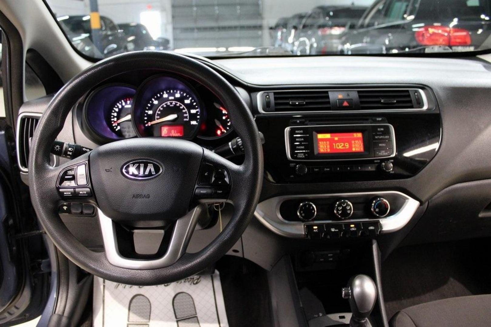 2016 Urban Blue Pearl Metallic /Black Kia Rio LX (KNADM4A30G6) with an 1.6L I4 DGI 16V engine, Automatic transmission, located at 15300 Midway Rd., Addison, TX, 75001, (972) 702-0011, 32.958321, -96.838074 - 2016 Kia Rio LX<br>Now Available at Midway Auto Group Addison, Texas<br><br>Efficient, reliable, and easy to drivethe 2016 Kia Rio LX is a smart choice for anyone seeking affordable transportation without sacrificing comfort or style. With its compact size, strong fuel economy, and solid build qual - Photo#14