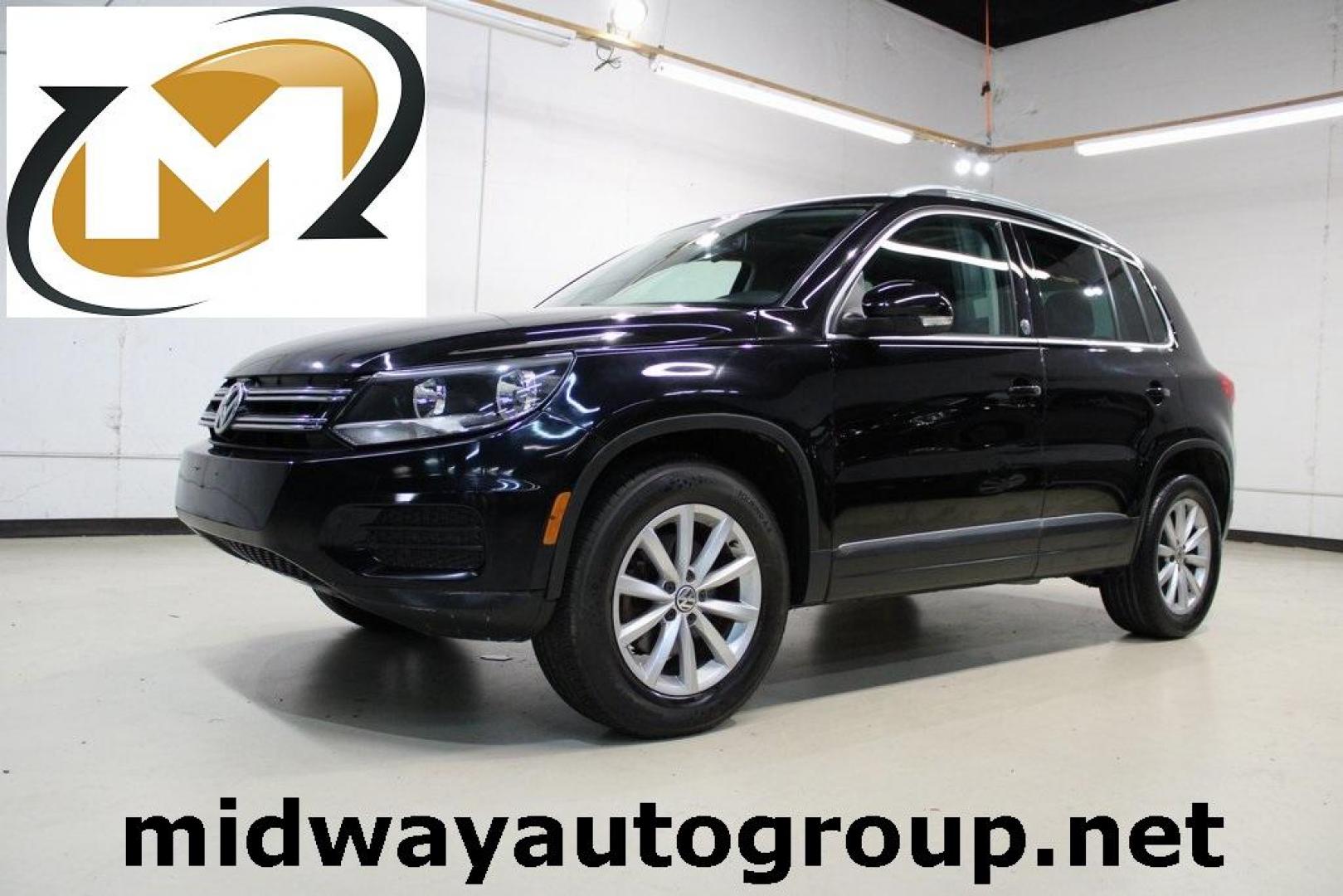 2017 Deep Black /Charcoal Black Volkswagen Tiguan 2.0T Wolfsburg Edition (WVGRV7AX4HK) with an 2.0L TSI DOHC engine, Automatic transmission, located at 15300 Midway Rd., Addison, TX, 75001, (972) 702-0011, 32.958321, -96.838074 - 2017 Volkswagen Touareg V6 Wolfsburg Edition<br>Now Available at Midway Auto Group Addison, Texas<br><br>Premium, powerful, and well-equipped, the 2017 Volkswagen Touareg Wolfsburg Edition delivers luxury SUV refinement with German-engineered performance. With a smooth V6 engine, a richly appointed - Photo#0