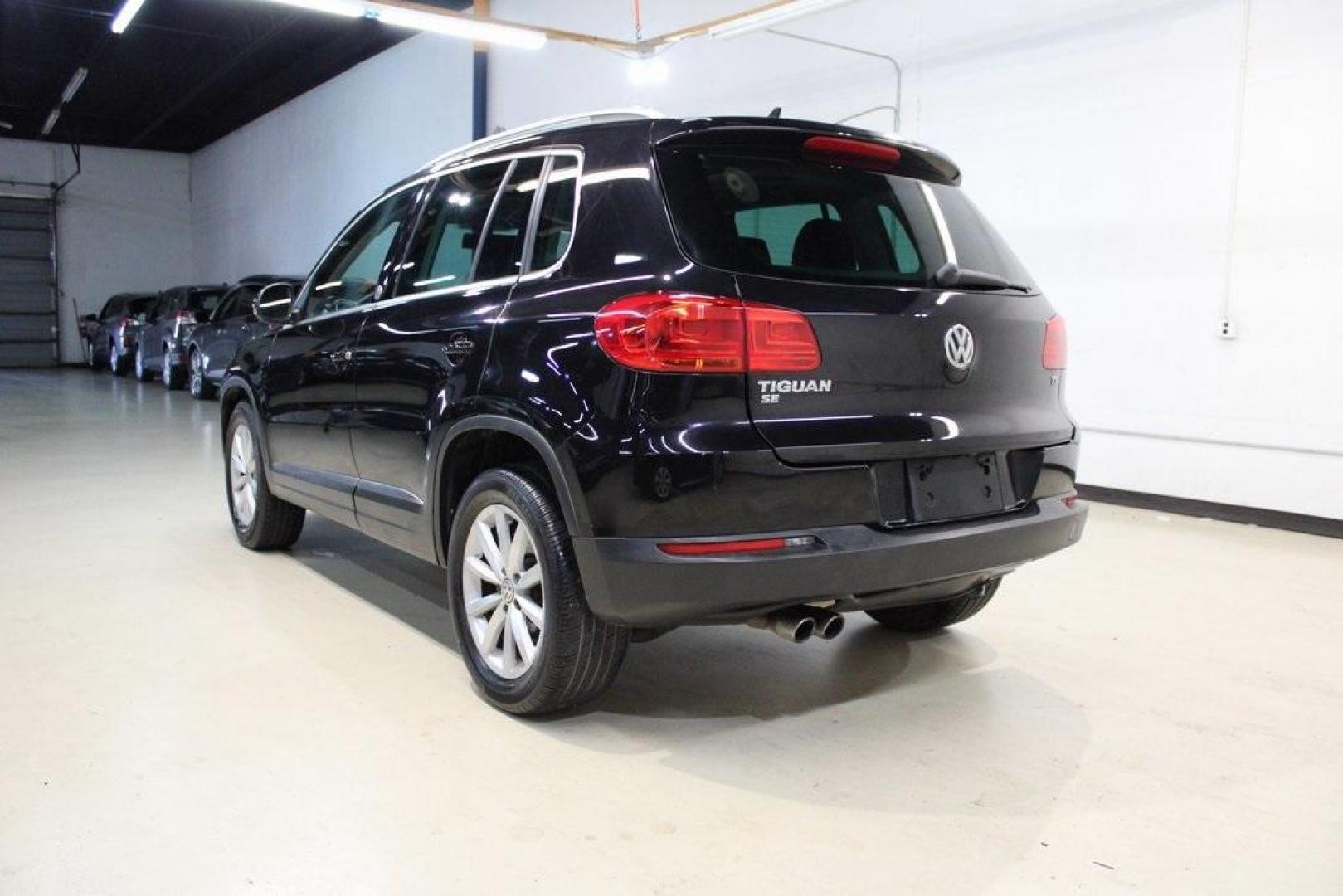 2017 Deep Black /Charcoal Black Volkswagen Tiguan 2.0T Wolfsburg Edition (WVGRV7AX4HK) with an 2.0L TSI DOHC engine, Automatic transmission, located at 15300 Midway Rd., Addison, TX, 75001, (972) 702-0011, 32.958321, -96.838074 - 2017 Volkswagen Touareg V6 Wolfsburg Edition<br>Now Available at Midway Auto Group Addison, Texas<br><br>Premium, powerful, and well-equipped, the 2017 Volkswagen Touareg Wolfsburg Edition delivers luxury SUV refinement with German-engineered performance. With a smooth V6 engine, a richly appointed - Photo#3