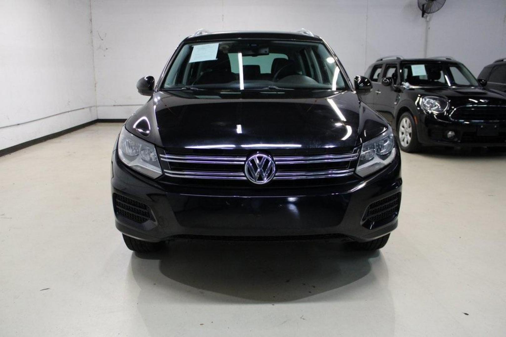 2017 Deep Black /Charcoal Black Volkswagen Tiguan 2.0T Wolfsburg Edition (WVGRV7AX4HK) with an 2.0L TSI DOHC engine, Automatic transmission, located at 15300 Midway Rd., Addison, TX, 75001, (972) 702-0011, 32.958321, -96.838074 - 2017 Volkswagen Touareg V6 Wolfsburg Edition<br>Now Available at Midway Auto Group Addison, Texas<br><br>Premium, powerful, and well-equipped, the 2017 Volkswagen Touareg Wolfsburg Edition delivers luxury SUV refinement with German-engineered performance. With a smooth V6 engine, a richly appointed - Photo#5