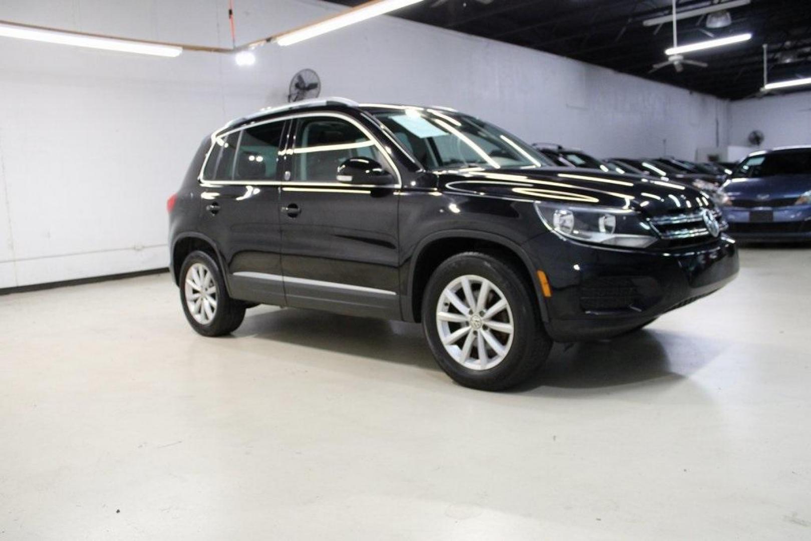 2017 Deep Black /Charcoal Black Volkswagen Tiguan 2.0T Wolfsburg Edition (WVGRV7AX4HK) with an 2.0L TSI DOHC engine, Automatic transmission, located at 15300 Midway Rd., Addison, TX, 75001, (972) 702-0011, 32.958321, -96.838074 - 2017 Volkswagen Touareg V6 Wolfsburg Edition<br>Now Available at Midway Auto Group Addison, Texas<br><br>Premium, powerful, and well-equipped, the 2017 Volkswagen Touareg Wolfsburg Edition delivers luxury SUV refinement with German-engineered performance. With a smooth V6 engine, a richly appointed - Photo#6