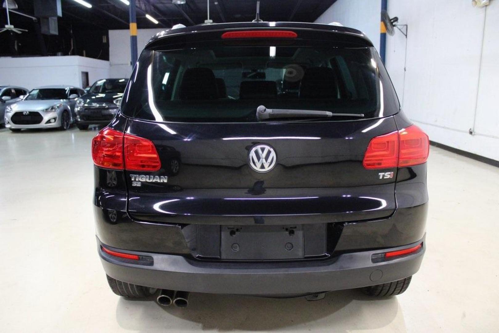 2017 Deep Black /Charcoal Black Volkswagen Tiguan 2.0T Wolfsburg Edition (WVGRV7AX4HK) with an 2.0L TSI DOHC engine, Automatic transmission, located at 15300 Midway Rd., Addison, TX, 75001, (972) 702-0011, 32.958321, -96.838074 - 2017 Volkswagen Touareg V6 Wolfsburg Edition<br>Now Available at Midway Auto Group Addison, Texas<br><br>Premium, powerful, and well-equipped, the 2017 Volkswagen Touareg Wolfsburg Edition delivers luxury SUV refinement with German-engineered performance. With a smooth V6 engine, a richly appointed - Photo#7