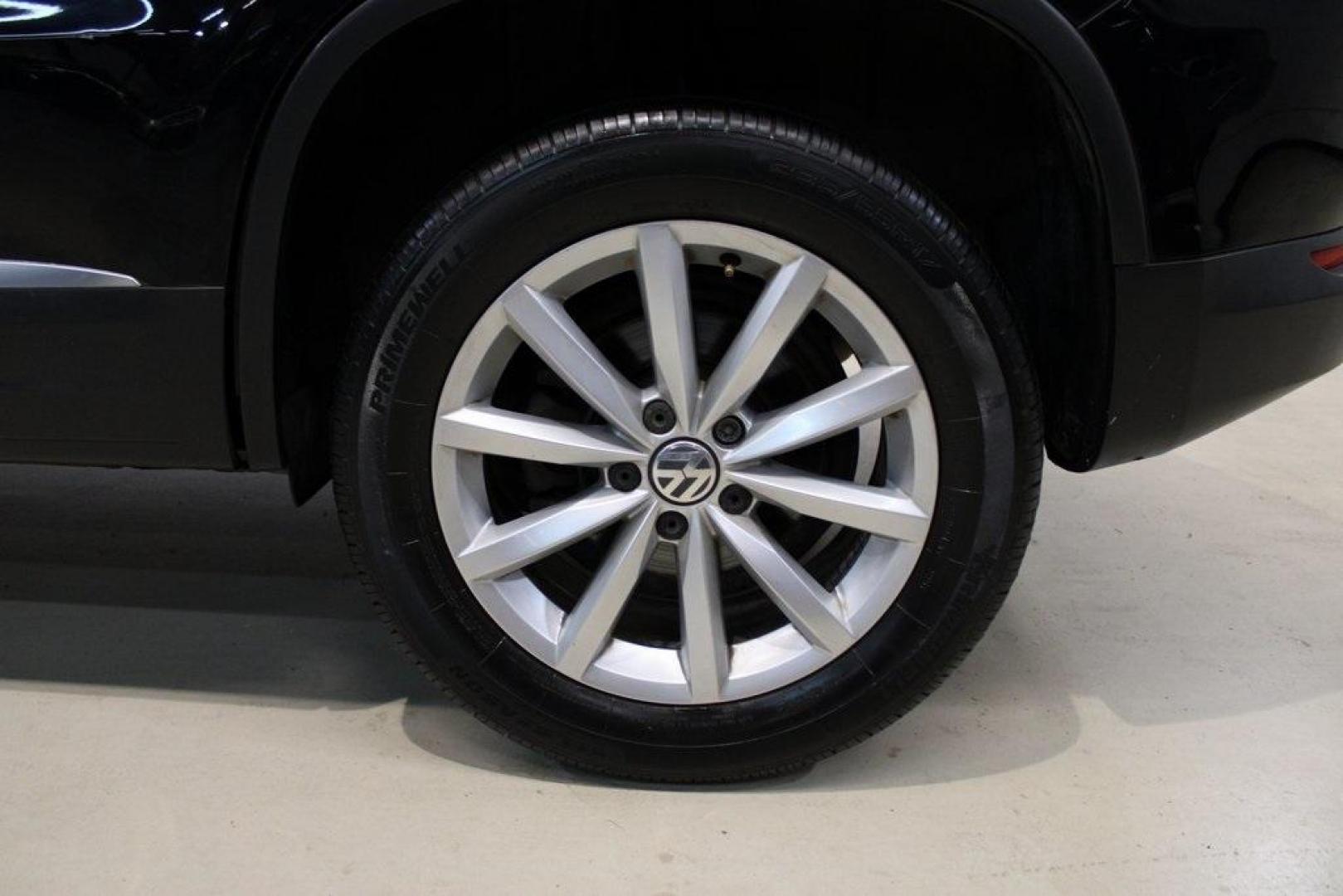 2017 Deep Black /Charcoal Black Volkswagen Tiguan 2.0T Wolfsburg Edition (WVGRV7AX4HK) with an 2.0L TSI DOHC engine, Automatic transmission, located at 15300 Midway Rd., Addison, TX, 75001, (972) 702-0011, 32.958321, -96.838074 - 2017 Volkswagen Touareg V6 Wolfsburg Edition<br>Now Available at Midway Auto Group Addison, Texas<br><br>Premium, powerful, and well-equipped, the 2017 Volkswagen Touareg Wolfsburg Edition delivers luxury SUV refinement with German-engineered performance. With a smooth V6 engine, a richly appointed - Photo#9