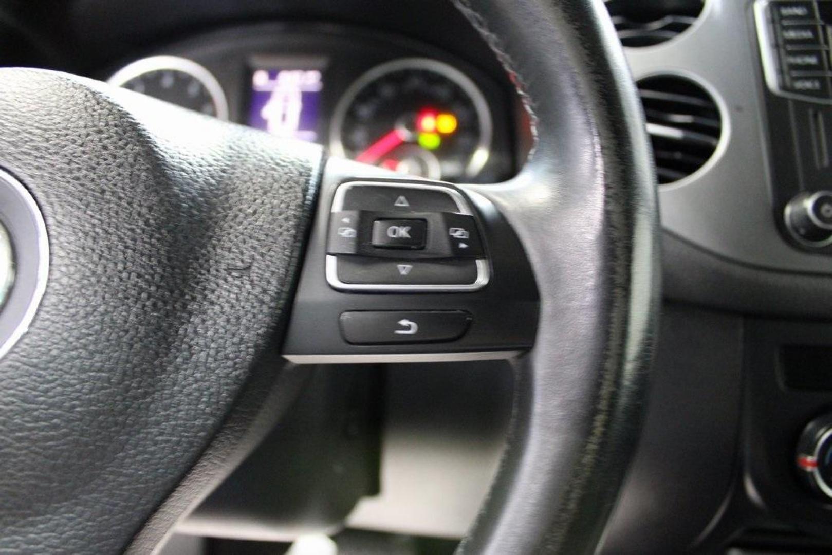 2017 Deep Black /Charcoal Black Volkswagen Tiguan 2.0T Wolfsburg Edition (WVGRV7AX4HK) with an 2.0L TSI DOHC engine, Automatic transmission, located at 15300 Midway Rd., Addison, TX, 75001, (972) 702-0011, 32.958321, -96.838074 - 2017 Volkswagen Touareg V6 Wolfsburg Edition<br>Now Available at Midway Auto Group Addison, Texas<br><br>Premium, powerful, and well-equipped, the 2017 Volkswagen Touareg Wolfsburg Edition delivers luxury SUV refinement with German-engineered performance. With a smooth V6 engine, a richly appointed - Photo#23