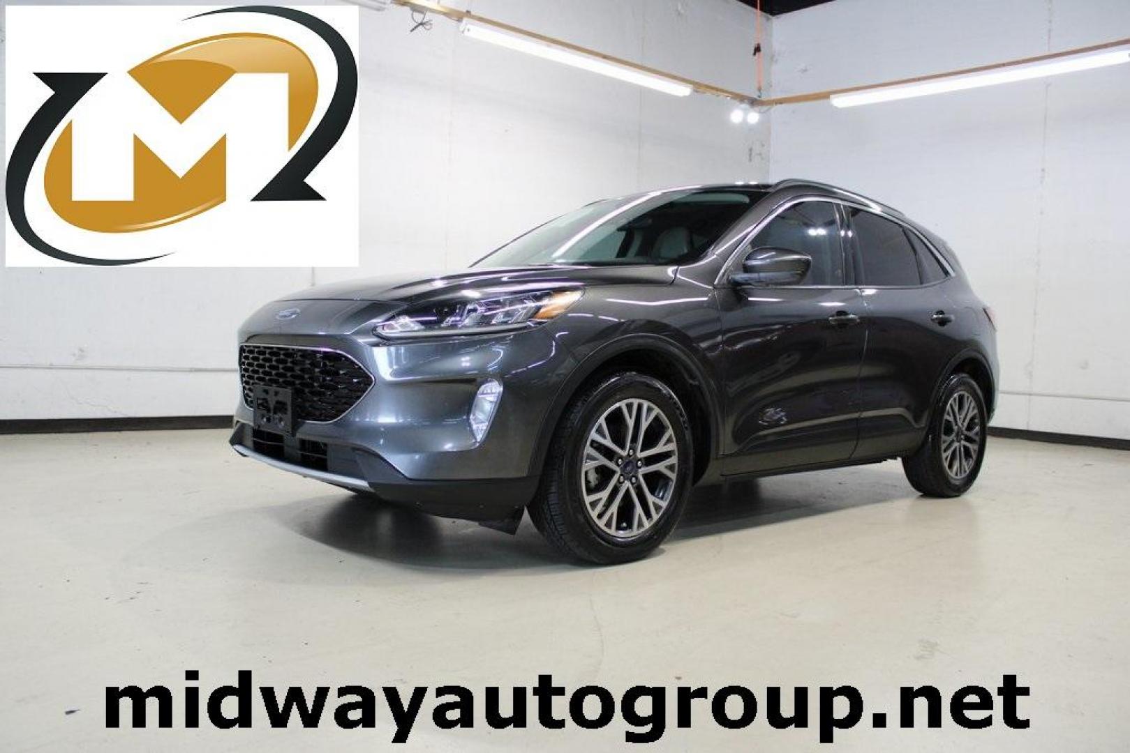2020 Magnetic /Sandstone Ford Escape SEL (1FMCU0H6XLU) with an 1.5L EcoBoost engine, Automatic transmission, located at 15300 Midway Rd., Addison, TX, 75001, (972) 702-0011, 32.958321, -96.838074 - 2020 Ford Escape SEL<br>Now Available at Midway Auto Group Addison, Texas<br><br>Smart, efficient, and loaded with modern features, the 2020 Ford Escape SEL is a standout compact SUV that blends versatility, technology, and comfort. Whether you're commuting around DFW or heading out for a weekend t - Photo#0