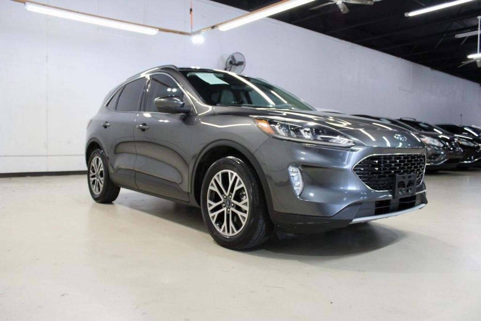 2020 Magnetic /Sandstone Ford Escape SEL (1FMCU0H6XLU) with an 1.5L EcoBoost engine, Automatic transmission, located at 15300 Midway Rd., Addison, TX, 75001, (972) 702-0011, 32.958321, -96.838074 - 2020 Ford Escape SEL<br>Now Available at Midway Auto Group Addison, Texas<br><br>Smart, efficient, and loaded with modern features, the 2020 Ford Escape SEL is a standout compact SUV that blends versatility, technology, and comfort. Whether you're commuting around DFW or heading out for a weekend t - Photo#1