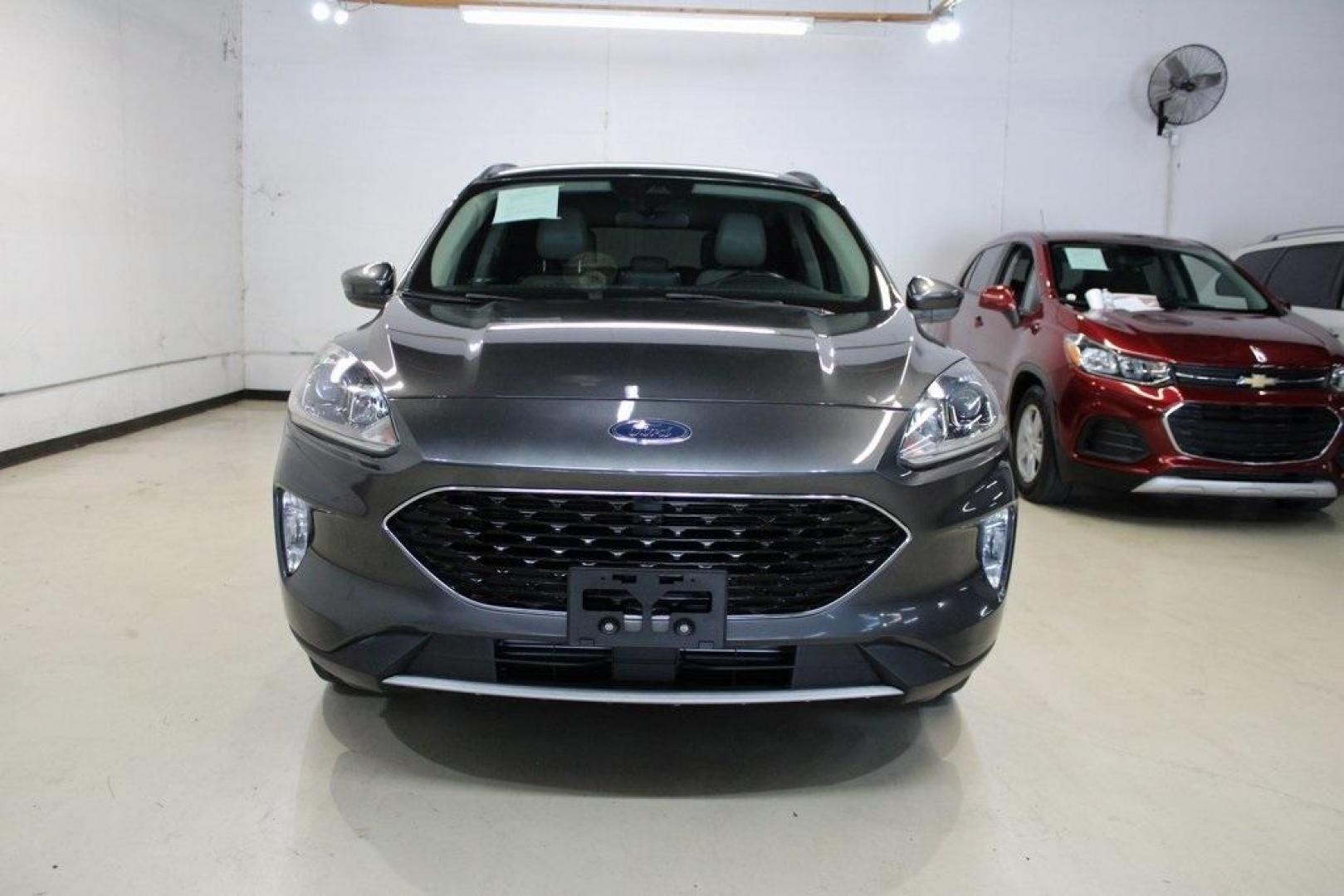 2020 Magnetic /Sandstone Ford Escape SEL (1FMCU0H6XLU) with an 1.5L EcoBoost engine, Automatic transmission, located at 15300 Midway Rd., Addison, TX, 75001, (972) 702-0011, 32.958321, -96.838074 - 2020 Ford Escape SEL<br>Now Available at Midway Auto Group Addison, Texas<br><br>Smart, efficient, and loaded with modern features, the 2020 Ford Escape SEL is a standout compact SUV that blends versatility, technology, and comfort. Whether you're commuting around DFW or heading out for a weekend t - Photo#5