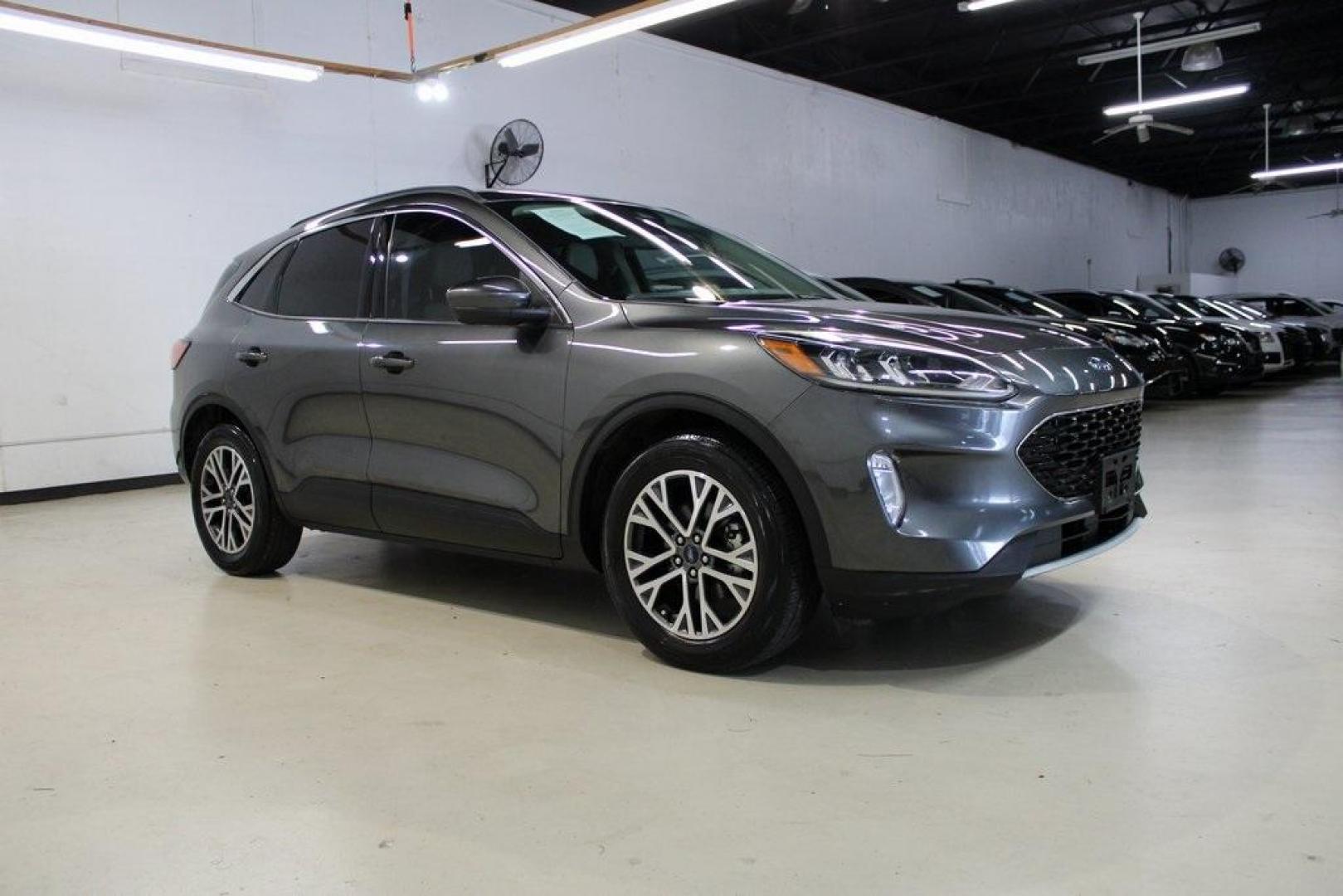 2020 Magnetic /Sandstone Ford Escape SEL (1FMCU0H6XLU) with an 1.5L EcoBoost engine, Automatic transmission, located at 15300 Midway Rd., Addison, TX, 75001, (972) 702-0011, 32.958321, -96.838074 - 2020 Ford Escape SEL<br>Now Available at Midway Auto Group Addison, Texas<br><br>Smart, efficient, and loaded with modern features, the 2020 Ford Escape SEL is a standout compact SUV that blends versatility, technology, and comfort. Whether you're commuting around DFW or heading out for a weekend t - Photo#6