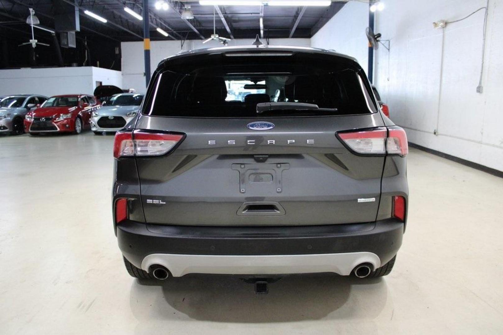 2020 Magnetic /Sandstone Ford Escape SEL (1FMCU0H6XLU) with an 1.5L EcoBoost engine, Automatic transmission, located at 15300 Midway Rd., Addison, TX, 75001, (972) 702-0011, 32.958321, -96.838074 - 2020 Ford Escape SEL<br>Now Available at Midway Auto Group Addison, Texas<br><br>Smart, efficient, and loaded with modern features, the 2020 Ford Escape SEL is a standout compact SUV that blends versatility, technology, and comfort. Whether you're commuting around DFW or heading out for a weekend t - Photo#7