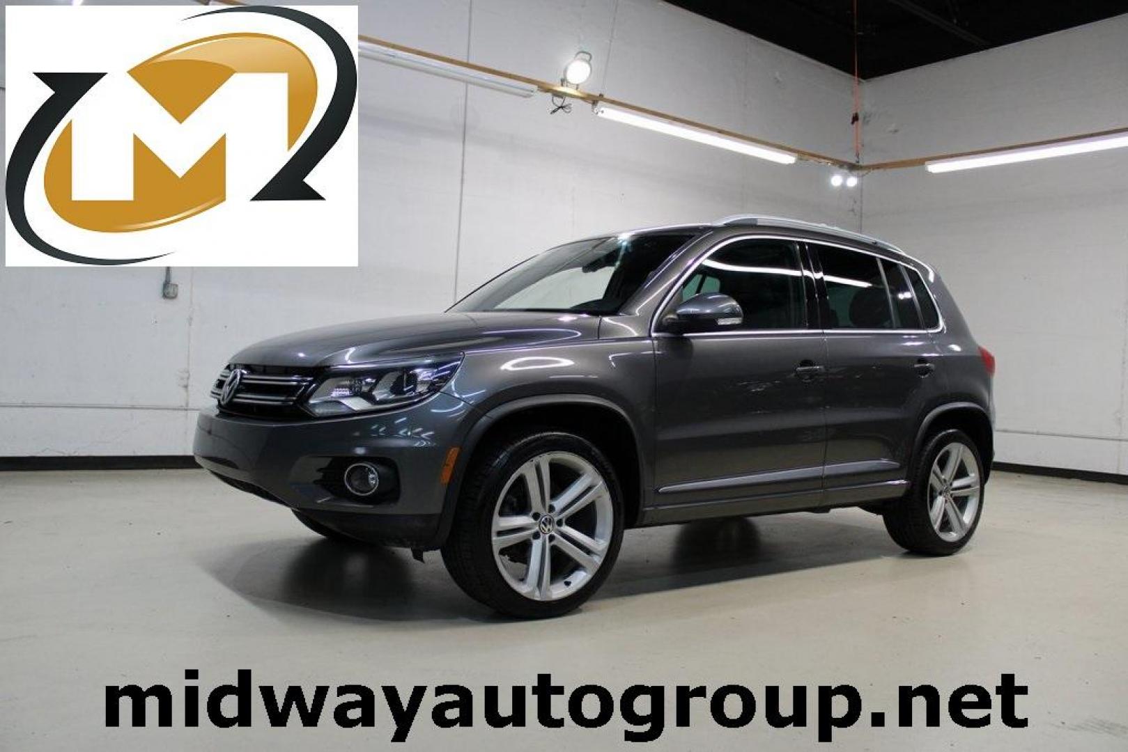 2014 Pepper / Gray /Black Volkswagen Tiguan R-Line (WVGAV3AX1EW) with an 2.0L TSI engine, Automatic transmission, located at 15300 Midway Rd., Addison, TX, 75001, (972) 702-0011, 32.958321, -96.838074 - 2014 Volkswagen Tiguan SE 4Motion<br>Now Available at Midway Auto Group Addison, Texas<br><br>Practicality meets refinement in the 2014 Volkswagen Tiguan SE 4Motiona compact SUV that delivers confident all-wheel drive performance, European styling, and a premium interior feel. Whether you're commut - Photo#0