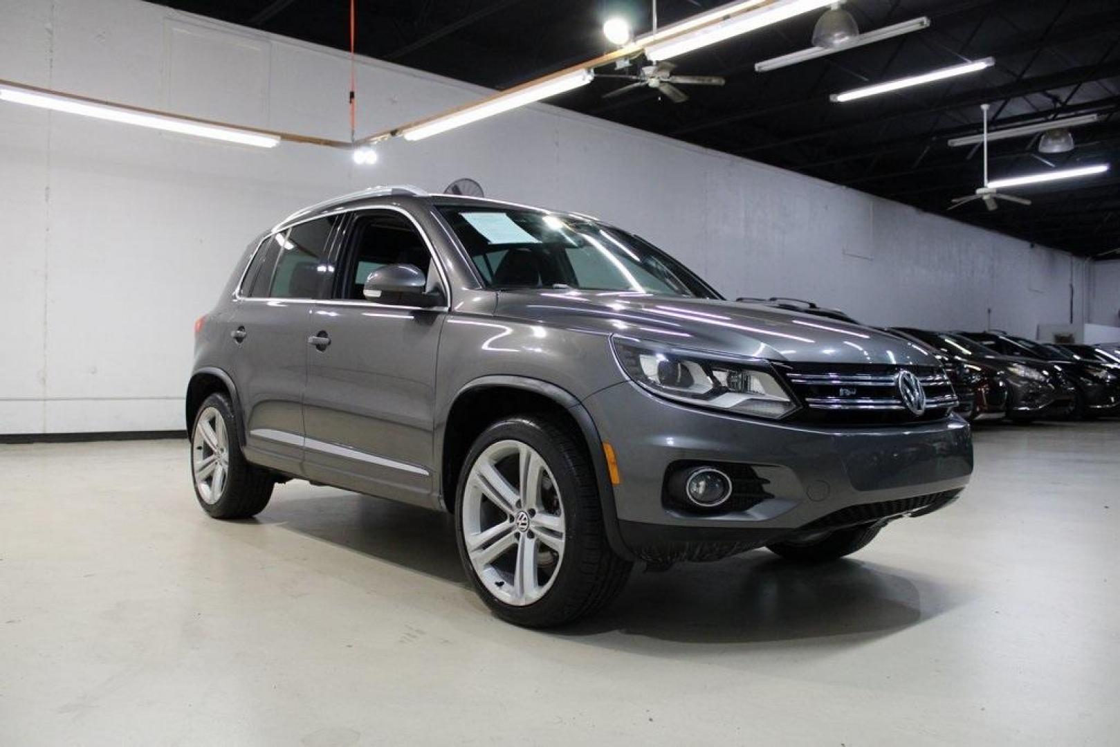 2014 Pepper / Gray /Black Volkswagen Tiguan R-Line (WVGAV3AX1EW) with an 2.0L TSI engine, Automatic transmission, located at 15300 Midway Rd., Addison, TX, 75001, (972) 702-0011, 32.958321, -96.838074 - 2014 Volkswagen Tiguan SE 4Motion<br>Now Available at Midway Auto Group Addison, Texas<br><br>Practicality meets refinement in the 2014 Volkswagen Tiguan SE 4Motiona compact SUV that delivers confident all-wheel drive performance, European styling, and a premium interior feel. Whether you're commut - Photo#1