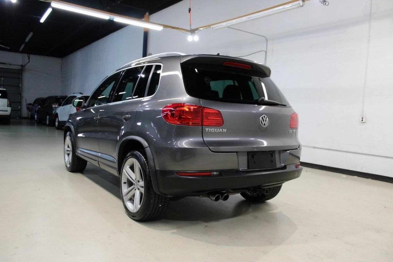 2014 Pepper / Gray /Black Volkswagen Tiguan R-Line (WVGAV3AX1EW) with an 2.0L TSI engine, Automatic transmission, located at 15300 Midway Rd., Addison, TX, 75001, (972) 702-0011, 32.958321, -96.838074 - 2014 Volkswagen Tiguan SE 4Motion<br>Now Available at Midway Auto Group Addison, Texas<br><br>Practicality meets refinement in the 2014 Volkswagen Tiguan SE 4Motiona compact SUV that delivers confident all-wheel drive performance, European styling, and a premium interior feel. Whether you're commut - Photo#3