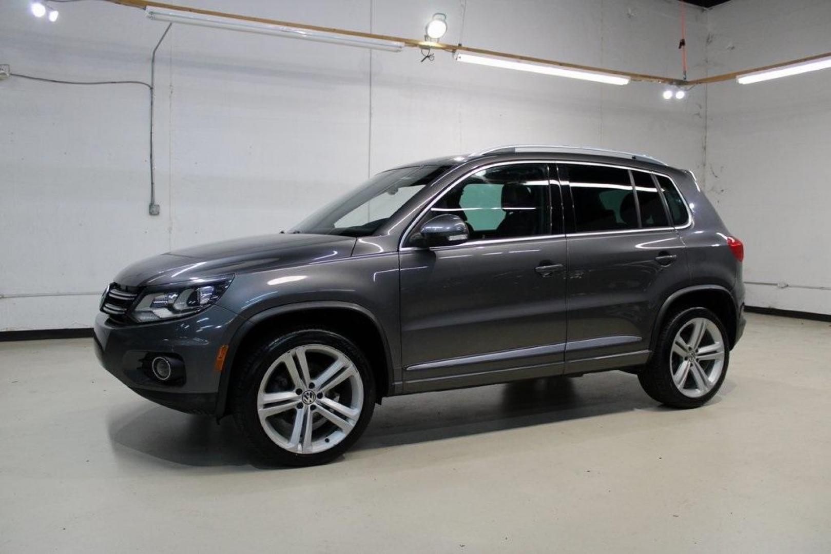 2014 Pepper / Gray /Black Volkswagen Tiguan R-Line (WVGAV3AX1EW) with an 2.0L TSI engine, Automatic transmission, located at 15300 Midway Rd., Addison, TX, 75001, (972) 702-0011, 32.958321, -96.838074 - 2014 Volkswagen Tiguan SE 4Motion<br>Now Available at Midway Auto Group Addison, Texas<br><br>Practicality meets refinement in the 2014 Volkswagen Tiguan SE 4Motiona compact SUV that delivers confident all-wheel drive performance, European styling, and a premium interior feel. Whether you're commut - Photo#4