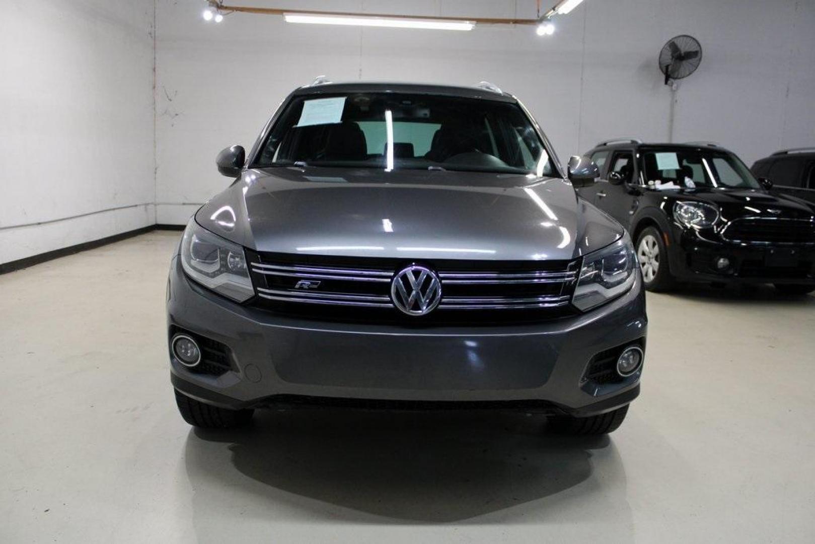 2014 Pepper / Gray /Black Volkswagen Tiguan R-Line (WVGAV3AX1EW) with an 2.0L TSI engine, Automatic transmission, located at 15300 Midway Rd., Addison, TX, 75001, (972) 702-0011, 32.958321, -96.838074 - 2014 Volkswagen Tiguan SE 4Motion<br>Now Available at Midway Auto Group Addison, Texas<br><br>Practicality meets refinement in the 2014 Volkswagen Tiguan SE 4Motiona compact SUV that delivers confident all-wheel drive performance, European styling, and a premium interior feel. Whether you're commut - Photo#5