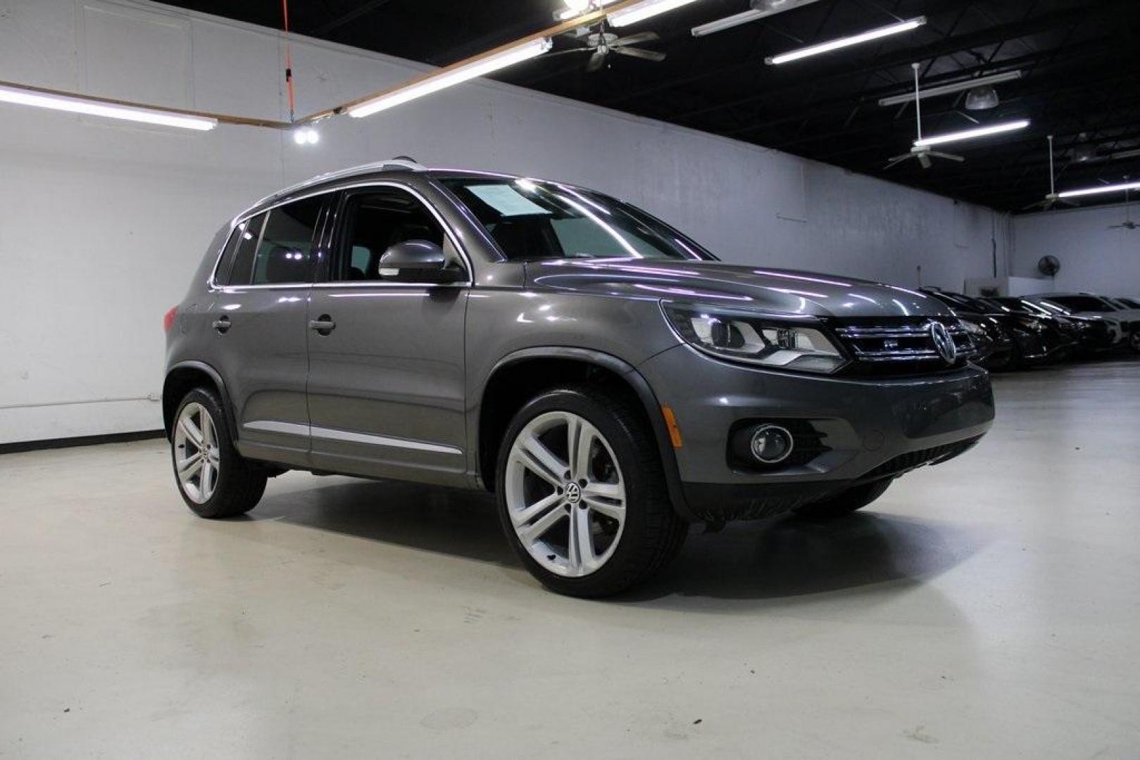 2014 Pepper / Gray /Black Volkswagen Tiguan R-Line (WVGAV3AX1EW) with an 2.0L TSI engine, Automatic transmission, located at 15300 Midway Rd., Addison, TX, 75001, (972) 702-0011, 32.958321, -96.838074 - 2014 Volkswagen Tiguan SE 4Motion<br>Now Available at Midway Auto Group Addison, Texas<br><br>Practicality meets refinement in the 2014 Volkswagen Tiguan SE 4Motiona compact SUV that delivers confident all-wheel drive performance, European styling, and a premium interior feel. Whether you're commut - Photo#6