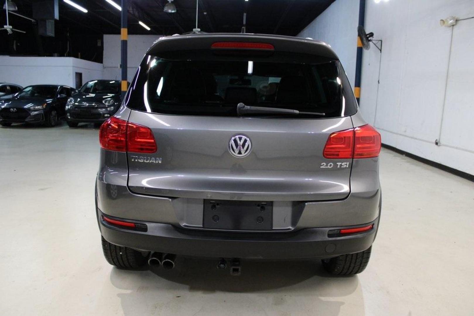 2014 Pepper / Gray /Black Volkswagen Tiguan R-Line (WVGAV3AX1EW) with an 2.0L TSI engine, Automatic transmission, located at 15300 Midway Rd., Addison, TX, 75001, (972) 702-0011, 32.958321, -96.838074 - 2014 Volkswagen Tiguan SE 4Motion<br>Now Available at Midway Auto Group Addison, Texas<br><br>Practicality meets refinement in the 2014 Volkswagen Tiguan SE 4Motiona compact SUV that delivers confident all-wheel drive performance, European styling, and a premium interior feel. Whether you're commut - Photo#7