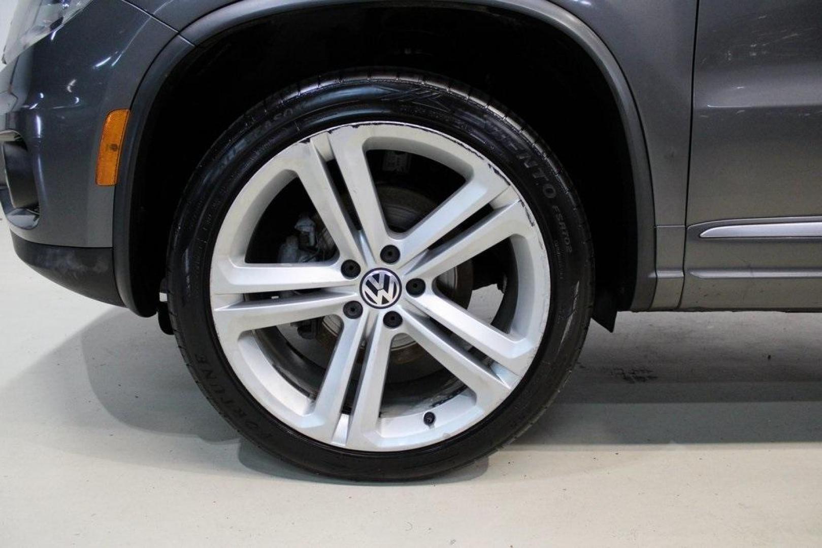 2014 Pepper / Gray /Black Volkswagen Tiguan R-Line (WVGAV3AX1EW) with an 2.0L TSI engine, Automatic transmission, located at 15300 Midway Rd., Addison, TX, 75001, (972) 702-0011, 32.958321, -96.838074 - 2014 Volkswagen Tiguan SE 4Motion<br>Now Available at Midway Auto Group Addison, Texas<br><br>Practicality meets refinement in the 2014 Volkswagen Tiguan SE 4Motiona compact SUV that delivers confident all-wheel drive performance, European styling, and a premium interior feel. Whether you're commut - Photo#8