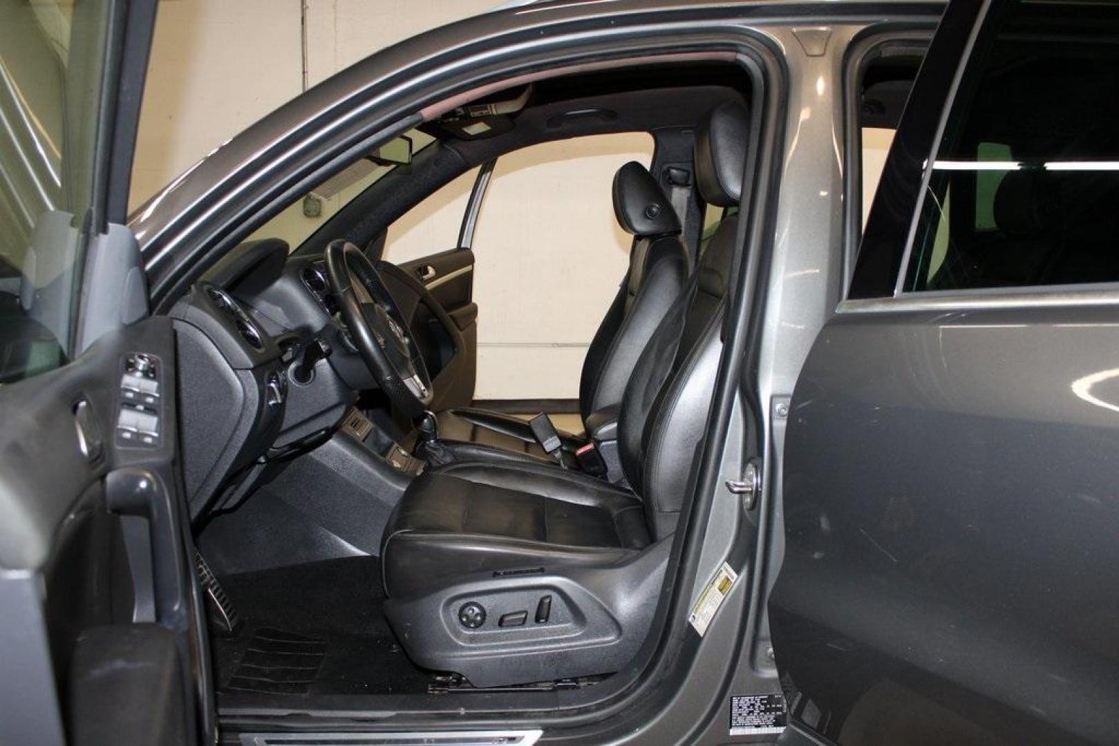 2014 Pepper / Gray /Black Volkswagen Tiguan R-Line (WVGAV3AX1EW) with an 2.0L TSI engine, Automatic transmission, located at 15300 Midway Rd., Addison, TX, 75001, (972) 702-0011, 32.958321, -96.838074 - 2014 Volkswagen Tiguan SE 4Motion<br>Now Available at Midway Auto Group Addison, Texas<br><br>Practicality meets refinement in the 2014 Volkswagen Tiguan SE 4Motiona compact SUV that delivers confident all-wheel drive performance, European styling, and a premium interior feel. Whether you're commut - Photo#13