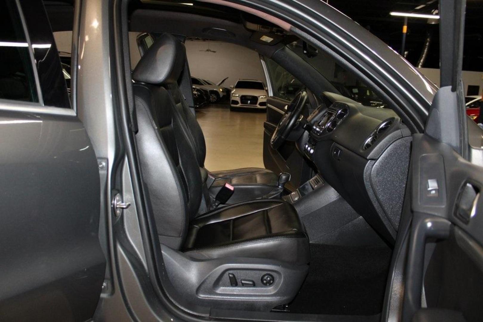 2014 Pepper / Gray /Black Volkswagen Tiguan R-Line (WVGAV3AX1EW) with an 2.0L TSI engine, Automatic transmission, located at 15300 Midway Rd., Addison, TX, 75001, (972) 702-0011, 32.958321, -96.838074 - 2014 Volkswagen Tiguan SE 4Motion<br>Now Available at Midway Auto Group Addison, Texas<br><br>Practicality meets refinement in the 2014 Volkswagen Tiguan SE 4Motiona compact SUV that delivers confident all-wheel drive performance, European styling, and a premium interior feel. Whether you're commut - Photo#14