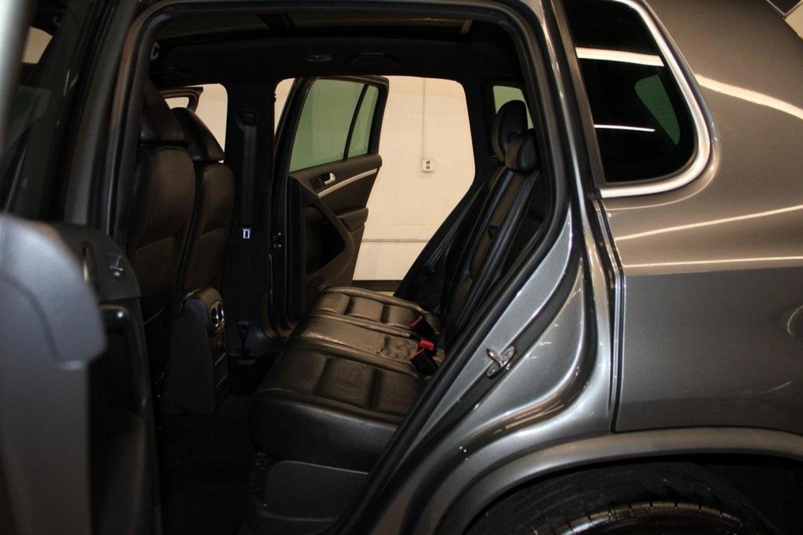 2014 Pepper / Gray /Black Volkswagen Tiguan R-Line (WVGAV3AX1EW) with an 2.0L TSI engine, Automatic transmission, located at 15300 Midway Rd., Addison, TX, 75001, (972) 702-0011, 32.958321, -96.838074 - 2014 Volkswagen Tiguan SE 4Motion<br>Now Available at Midway Auto Group Addison, Texas<br><br>Practicality meets refinement in the 2014 Volkswagen Tiguan SE 4Motiona compact SUV that delivers confident all-wheel drive performance, European styling, and a premium interior feel. Whether you're commut - Photo#16