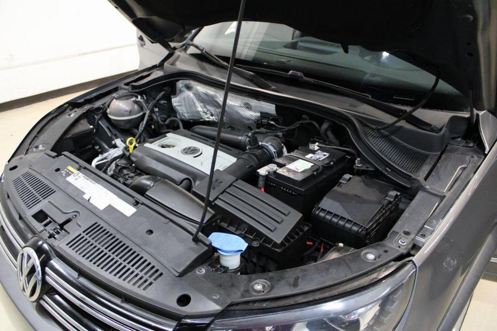 2014 Pepper / Gray /Black Volkswagen Tiguan R-Line (WVGAV3AX1EW) with an 2.0L TSI engine, Automatic transmission, located at 15300 Midway Rd., Addison, TX, 75001, (972) 702-0011, 32.958321, -96.838074 - 2014 Volkswagen Tiguan SE 4Motion<br>Now Available at Midway Auto Group Addison, Texas<br><br>Practicality meets refinement in the 2014 Volkswagen Tiguan SE 4Motiona compact SUV that delivers confident all-wheel drive performance, European styling, and a premium interior feel. Whether you're commut - Photo#30