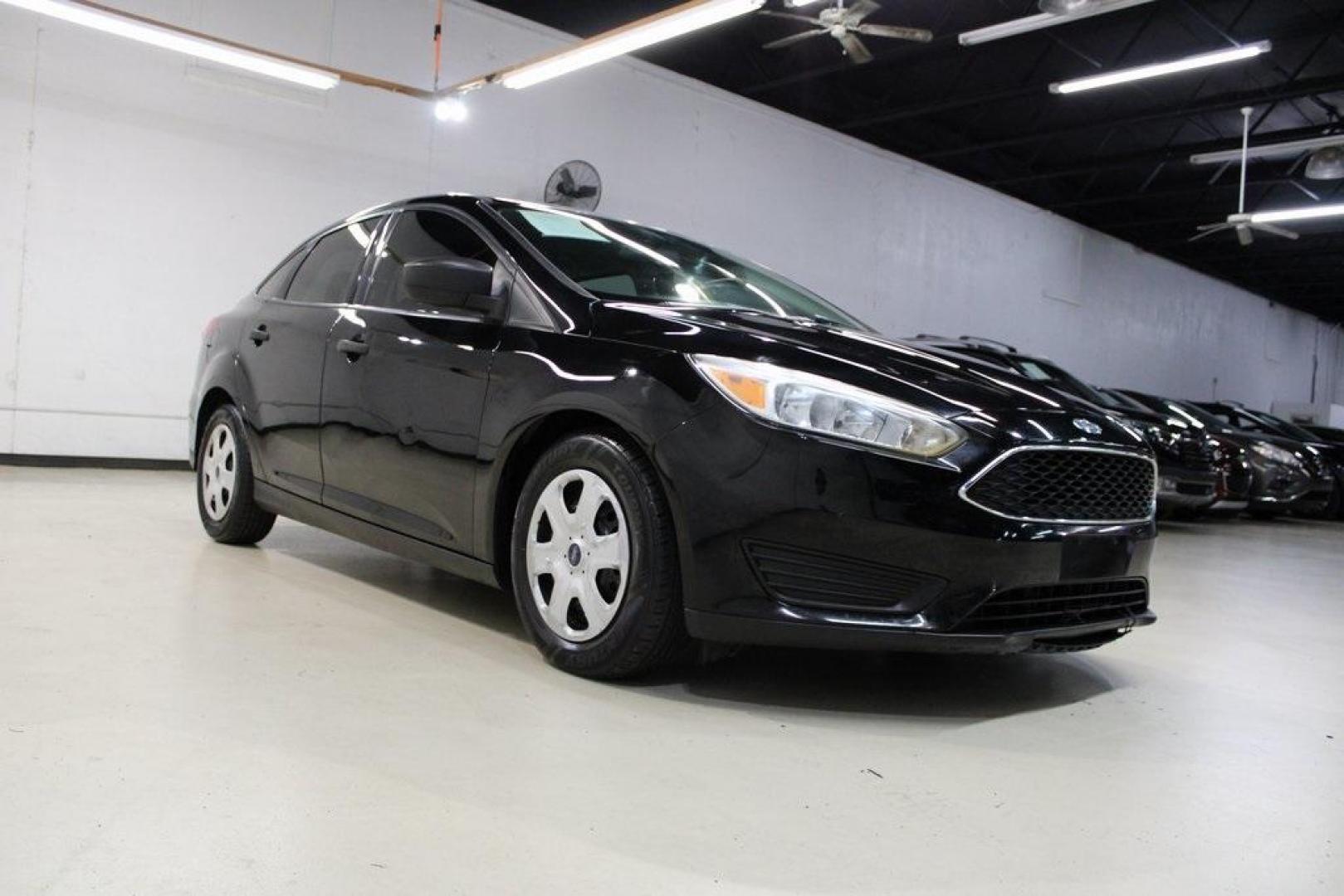 2018 Shadow Black /Charcoal Black Ford Focus S (1FADP3E20JL) with an 2.0L I4 DGI Ti-VCT engine, Automatic transmission, located at 15300 Midway Rd., Addison, TX, 75001, (972) 702-0011, 32.958321, -96.838074 - 2018 Ford Focus S<br>Now Available at Midway Auto Group Addison, Texas<br><br>Efficient, reliable, and fun to drivethe 2018 Ford Focus S is a compact sedan that offers outstanding value for daily commuters, first-time buyers, or anyone looking for practical, affordable transportation. With its nimb - Photo#1