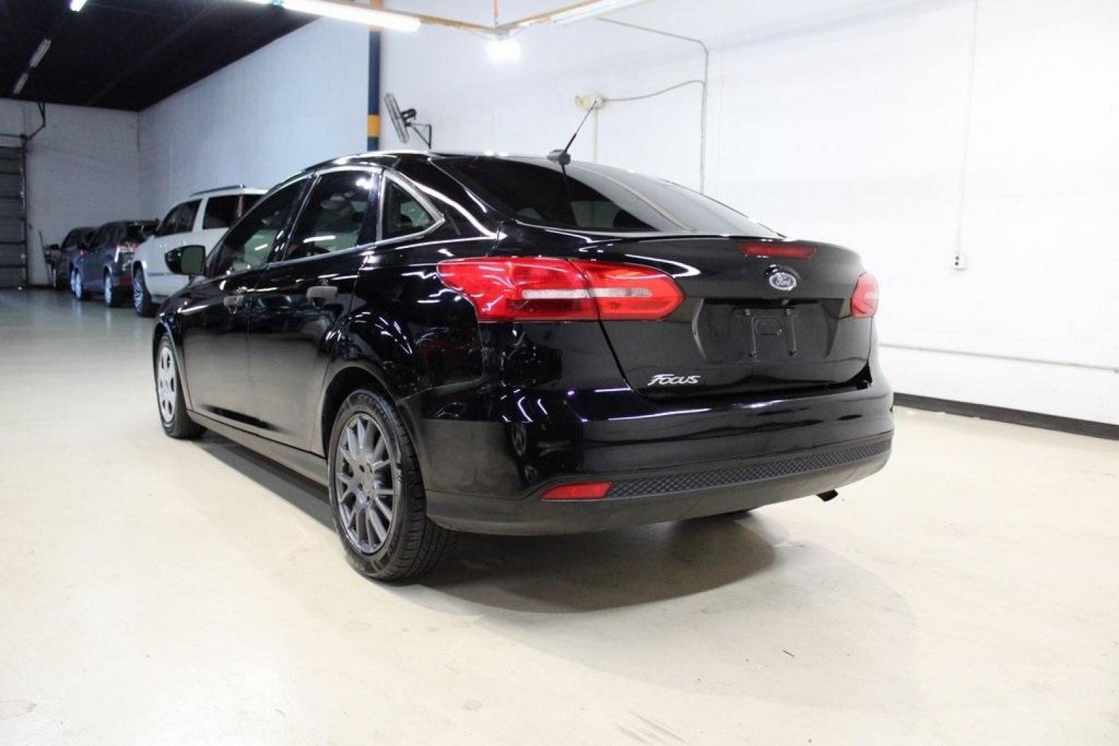 2018 Shadow Black /Charcoal Black Ford Focus S (1FADP3E20JL) with an 2.0L I4 DGI Ti-VCT engine, Automatic transmission, located at 15300 Midway Rd., Addison, TX, 75001, (972) 702-0011, 32.958321, -96.838074 - 2018 Ford Focus S<br>Now Available at Midway Auto Group Addison, Texas<br><br>Efficient, reliable, and fun to drivethe 2018 Ford Focus S is a compact sedan that offers outstanding value for daily commuters, first-time buyers, or anyone looking for practical, affordable transportation. With its nimb - Photo#3