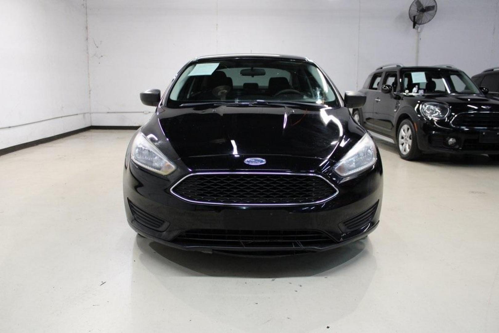 2018 Shadow Black /Charcoal Black Ford Focus S (1FADP3E20JL) with an 2.0L I4 DGI Ti-VCT engine, Automatic transmission, located at 15300 Midway Rd., Addison, TX, 75001, (972) 702-0011, 32.958321, -96.838074 - 2018 Ford Focus S<br>Now Available at Midway Auto Group Addison, Texas<br><br>Efficient, reliable, and fun to drivethe 2018 Ford Focus S is a compact sedan that offers outstanding value for daily commuters, first-time buyers, or anyone looking for practical, affordable transportation. With its nimb - Photo#5