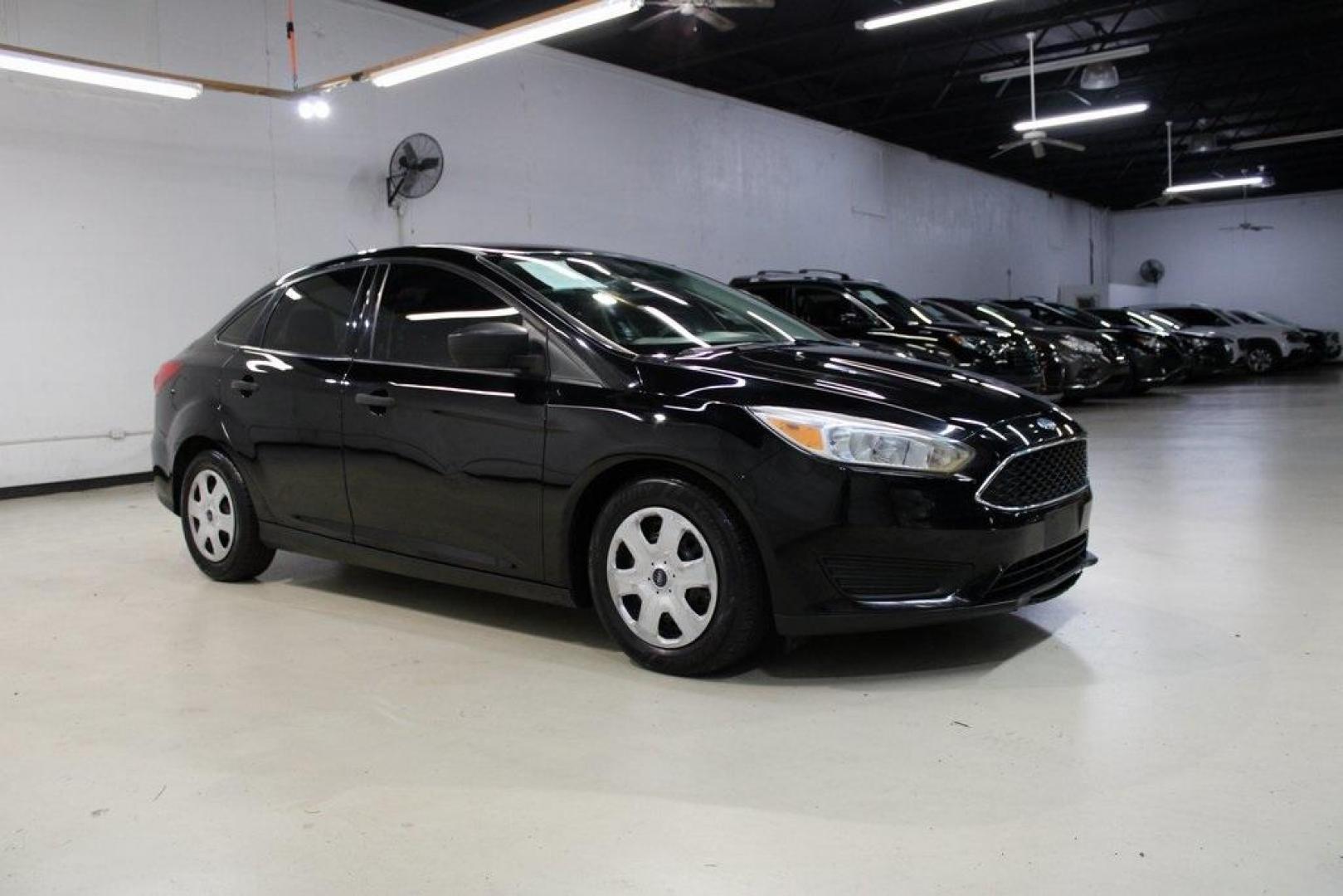 2018 Shadow Black /Charcoal Black Ford Focus S (1FADP3E20JL) with an 2.0L I4 DGI Ti-VCT engine, Automatic transmission, located at 15300 Midway Rd., Addison, TX, 75001, (972) 702-0011, 32.958321, -96.838074 - 2018 Ford Focus S<br>Now Available at Midway Auto Group Addison, Texas<br><br>Efficient, reliable, and fun to drivethe 2018 Ford Focus S is a compact sedan that offers outstanding value for daily commuters, first-time buyers, or anyone looking for practical, affordable transportation. With its nimb - Photo#6