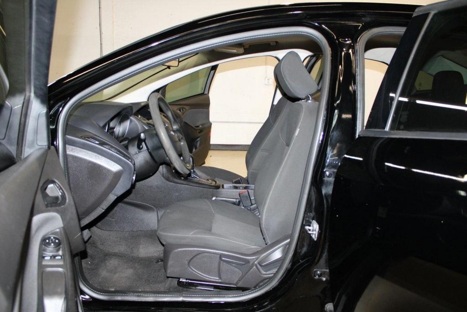 2018 Shadow Black /Charcoal Black Ford Focus S (1FADP3E20JL) with an 2.0L I4 DGI Ti-VCT engine, Automatic transmission, located at 15300 Midway Rd., Addison, TX, 75001, (972) 702-0011, 32.958321, -96.838074 - 2018 Ford Focus S<br>Now Available at Midway Auto Group Addison, Texas<br><br>Efficient, reliable, and fun to drivethe 2018 Ford Focus S is a compact sedan that offers outstanding value for daily commuters, first-time buyers, or anyone looking for practical, affordable transportation. With its nimb - Photo#12