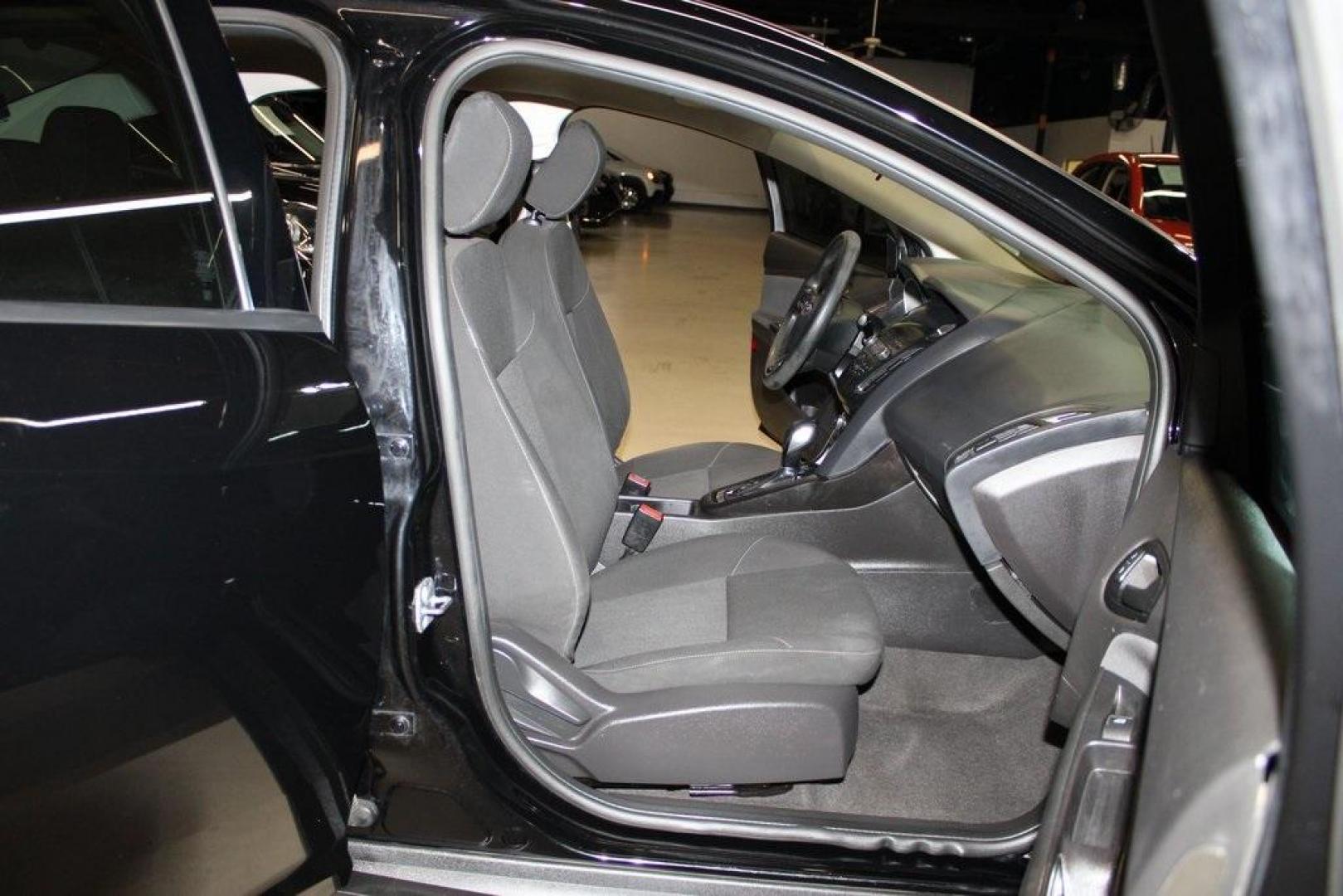 2018 Shadow Black /Charcoal Black Ford Focus S (1FADP3E20JL) with an 2.0L I4 DGI Ti-VCT engine, Automatic transmission, located at 15300 Midway Rd., Addison, TX, 75001, (972) 702-0011, 32.958321, -96.838074 - 2018 Ford Focus S<br>Now Available at Midway Auto Group Addison, Texas<br><br>Efficient, reliable, and fun to drivethe 2018 Ford Focus S is a compact sedan that offers outstanding value for daily commuters, first-time buyers, or anyone looking for practical, affordable transportation. With its nimb - Photo#13